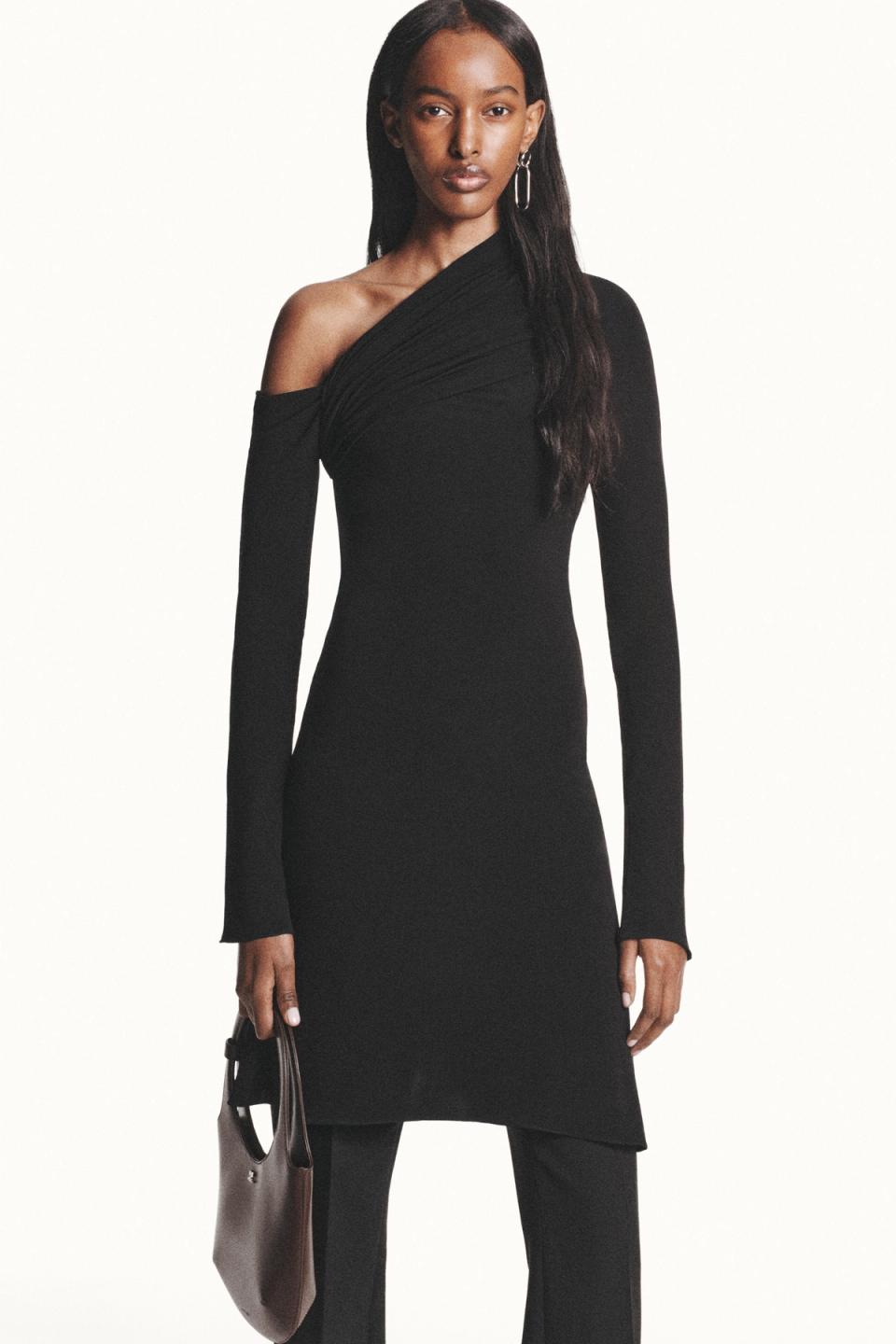 Elegant black Courrèges dress with single shoulder design, perfect for modern fashion statements.