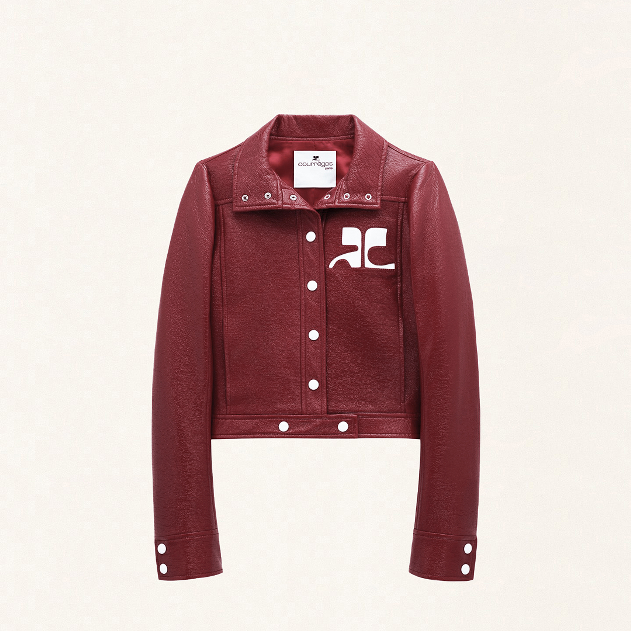 Elegant red leather jacket with Courrèges branding, perfect for modern fashion on an ecommerce site.