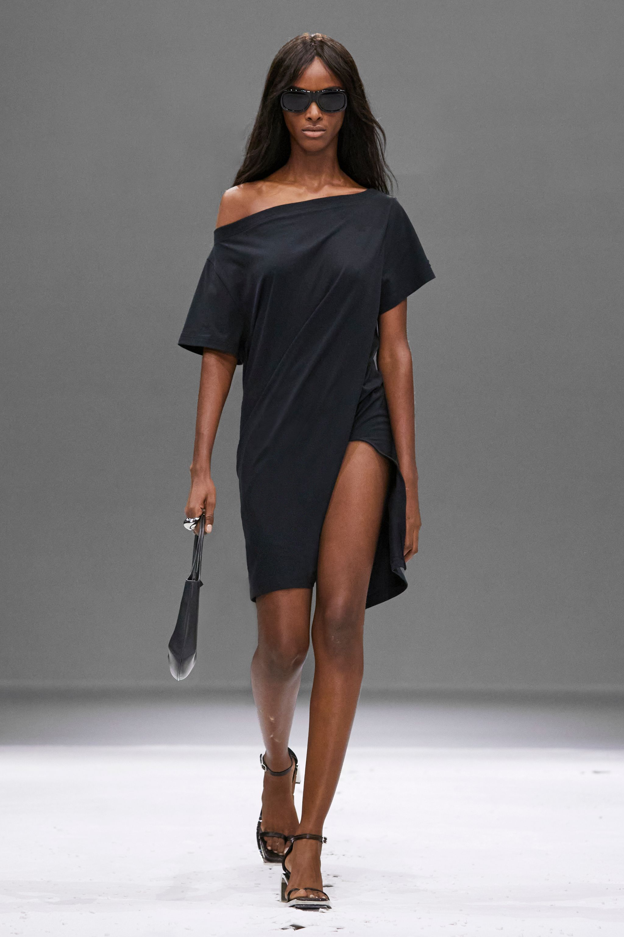 Elegant black dress with asymmetric off-shoulder design by Courrèges, perfect for fashion-forward looks.