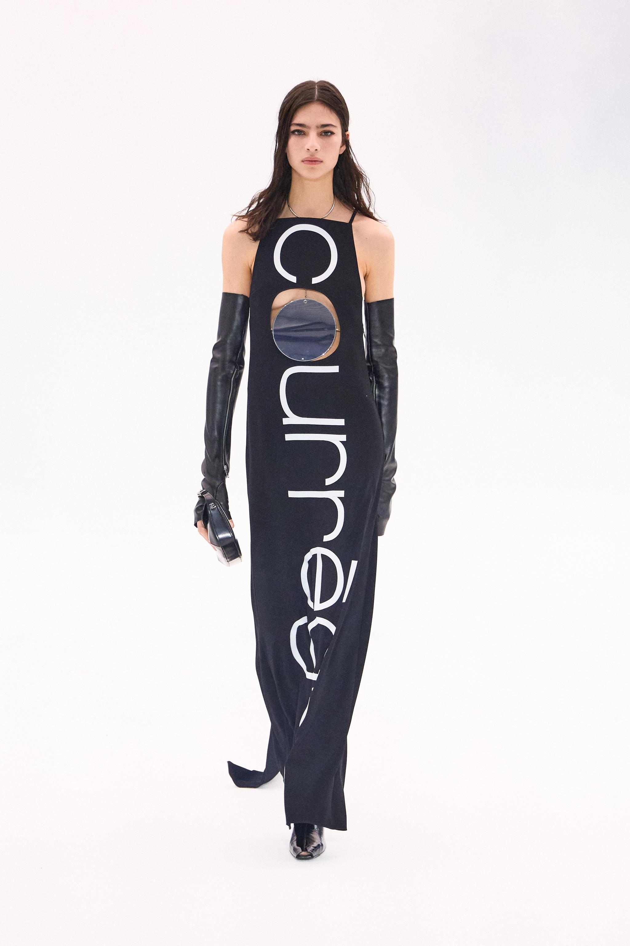 Elegant black Courrèges dress with cutouts and bold logo print, perfect for fashion lovers.