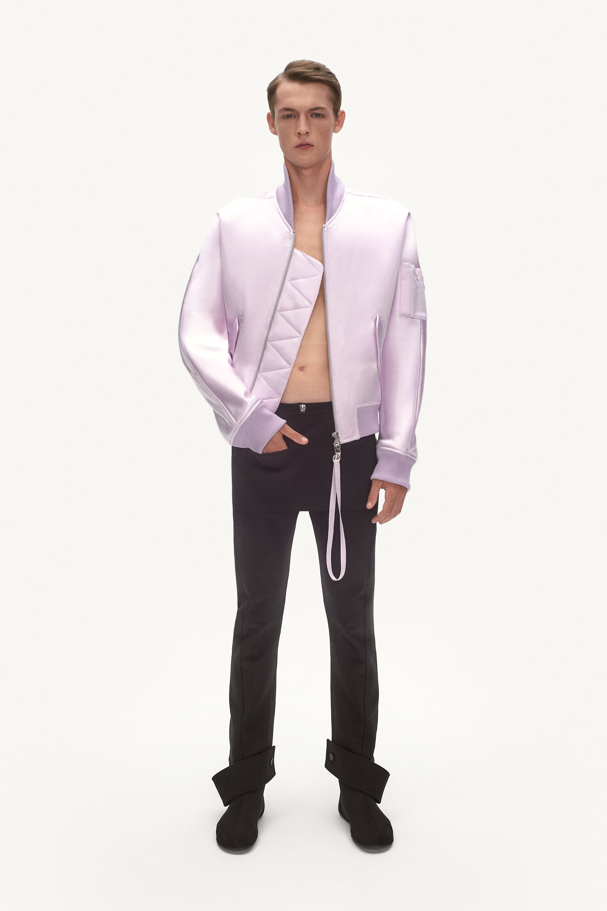 Elegant lavender satin bomber jacket with unique pocket design, perfect for Courrèges fashion. 