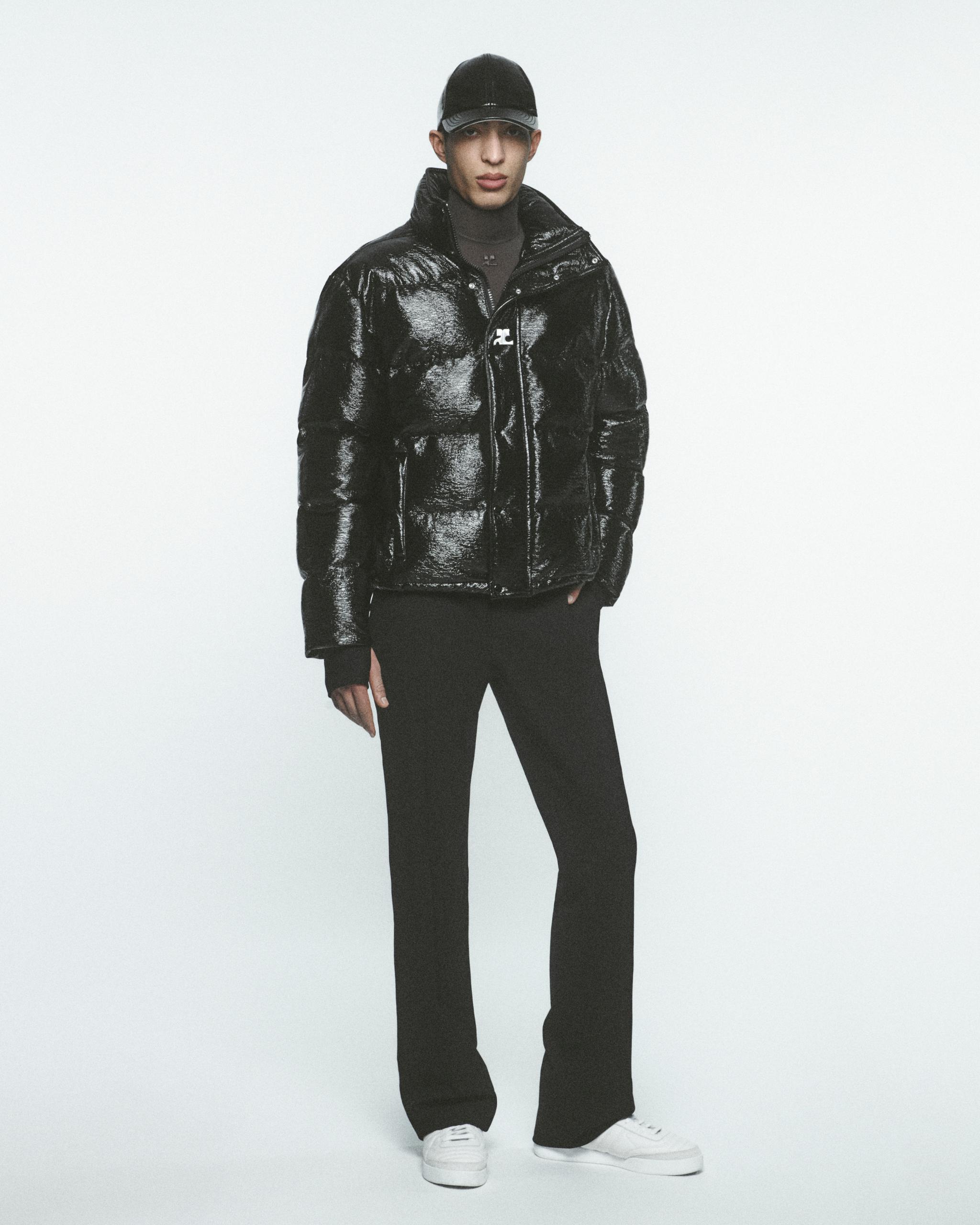 Elegant black shiny puffer jacket by Courrèges, perfect for modern urban fashion.