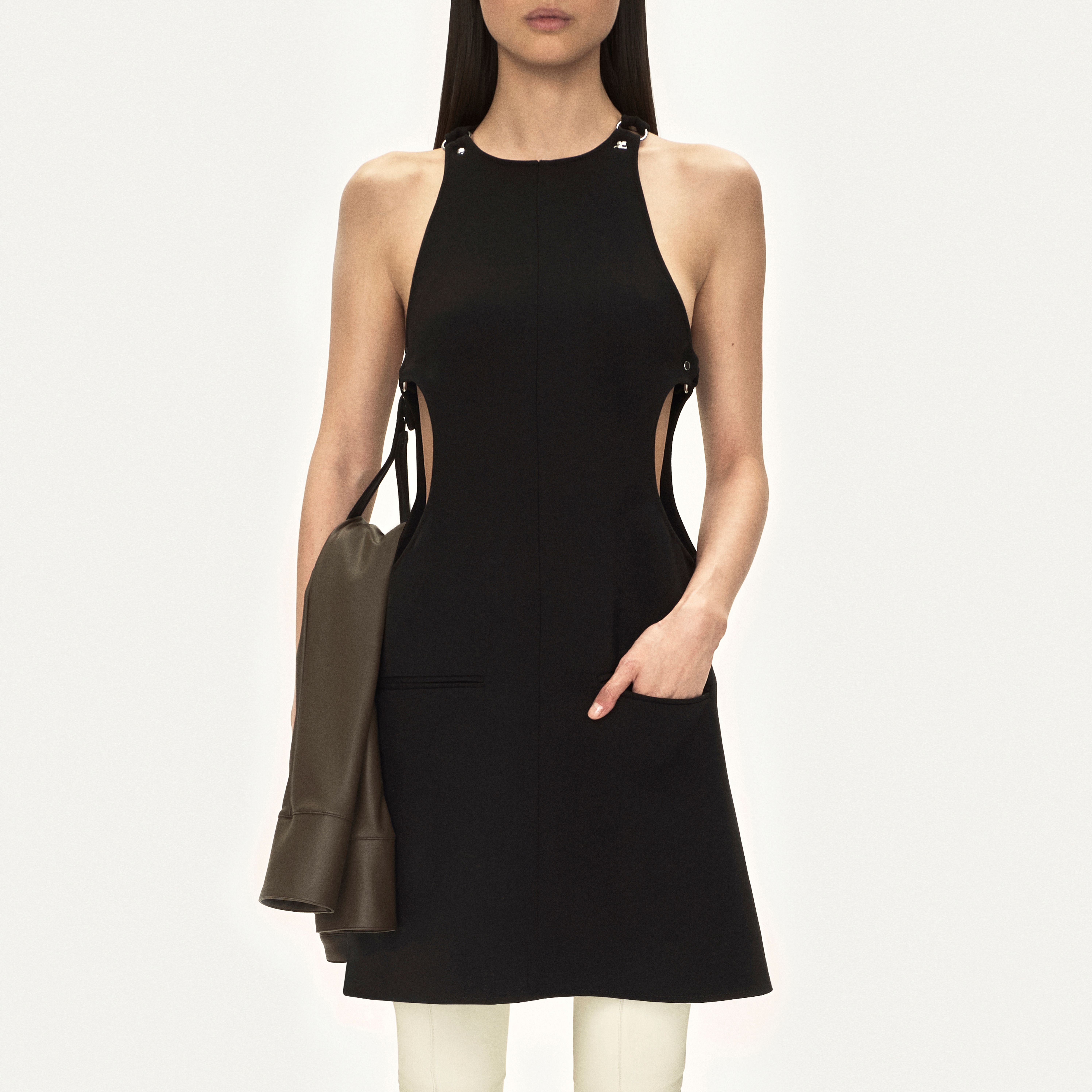 Elegant black cutout dress by Courrèges, featuring modern design details for fashion-forward style.