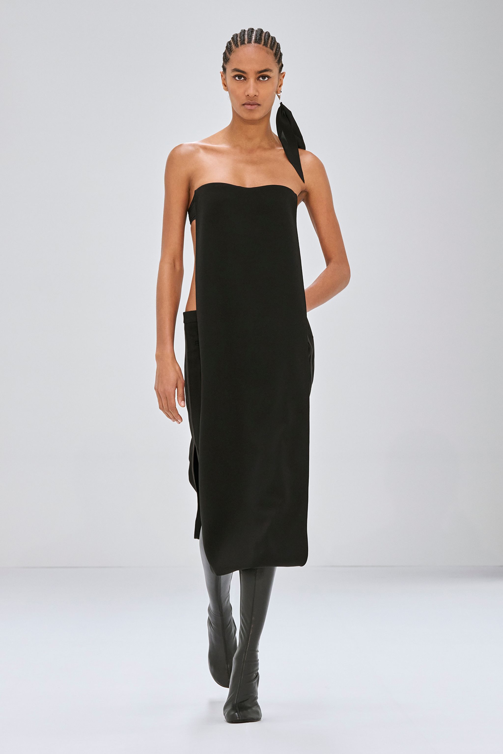 Elegant black strapless dress by Courrèges, featuring a modern minimalist design for fashion-forward women.