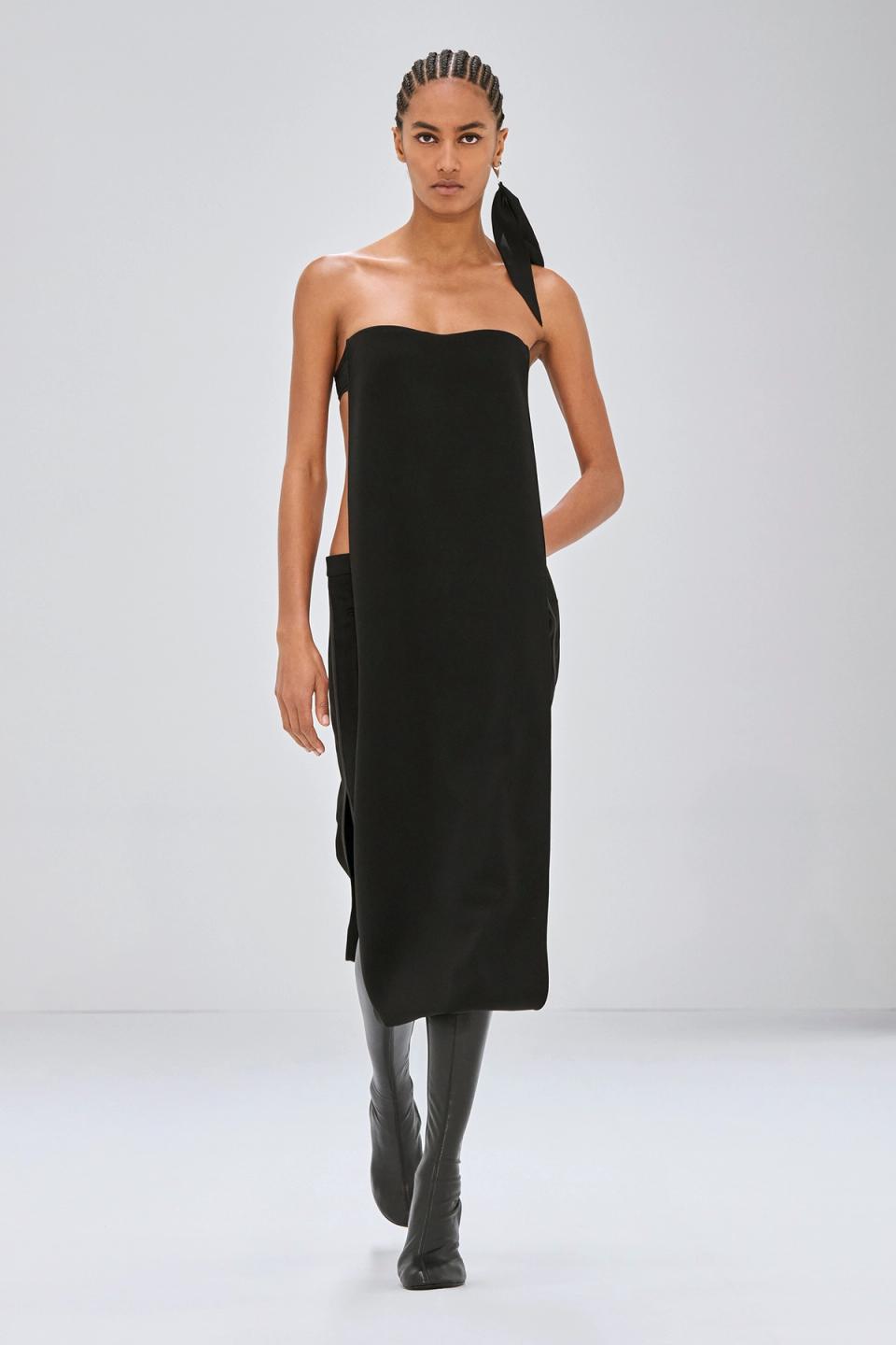 Elegant black strapless dress by Courrèges, featuring a modern minimalist design for fashion-forward women.