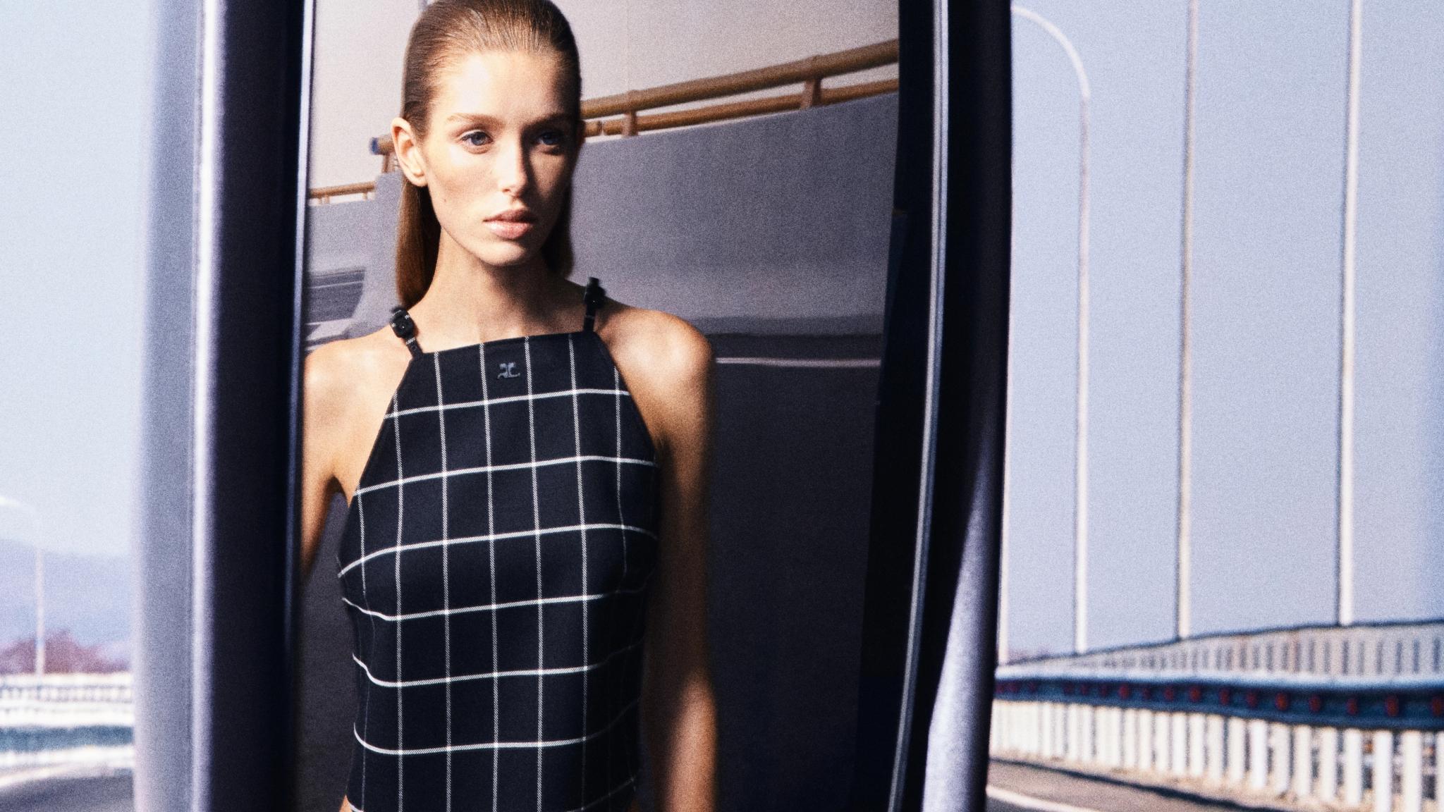 Elegant checkered dress by Courrèges showcased in a fashion ecommerce setting.