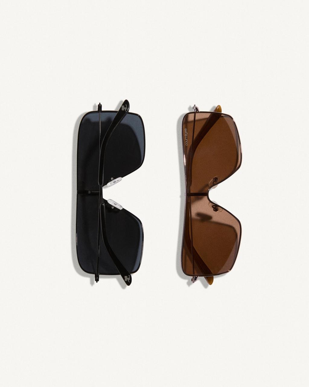 Elegant sunglasses with sleek frames, showcasing Courrèges' modern fashion style on an ecommerce site.