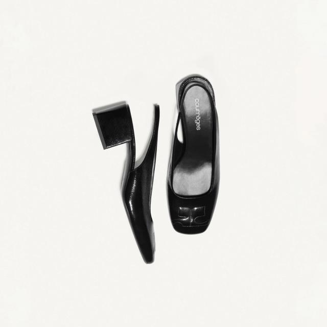 Elegant black leather heels from Courrèges, perfect for sophisticated fashion statements.