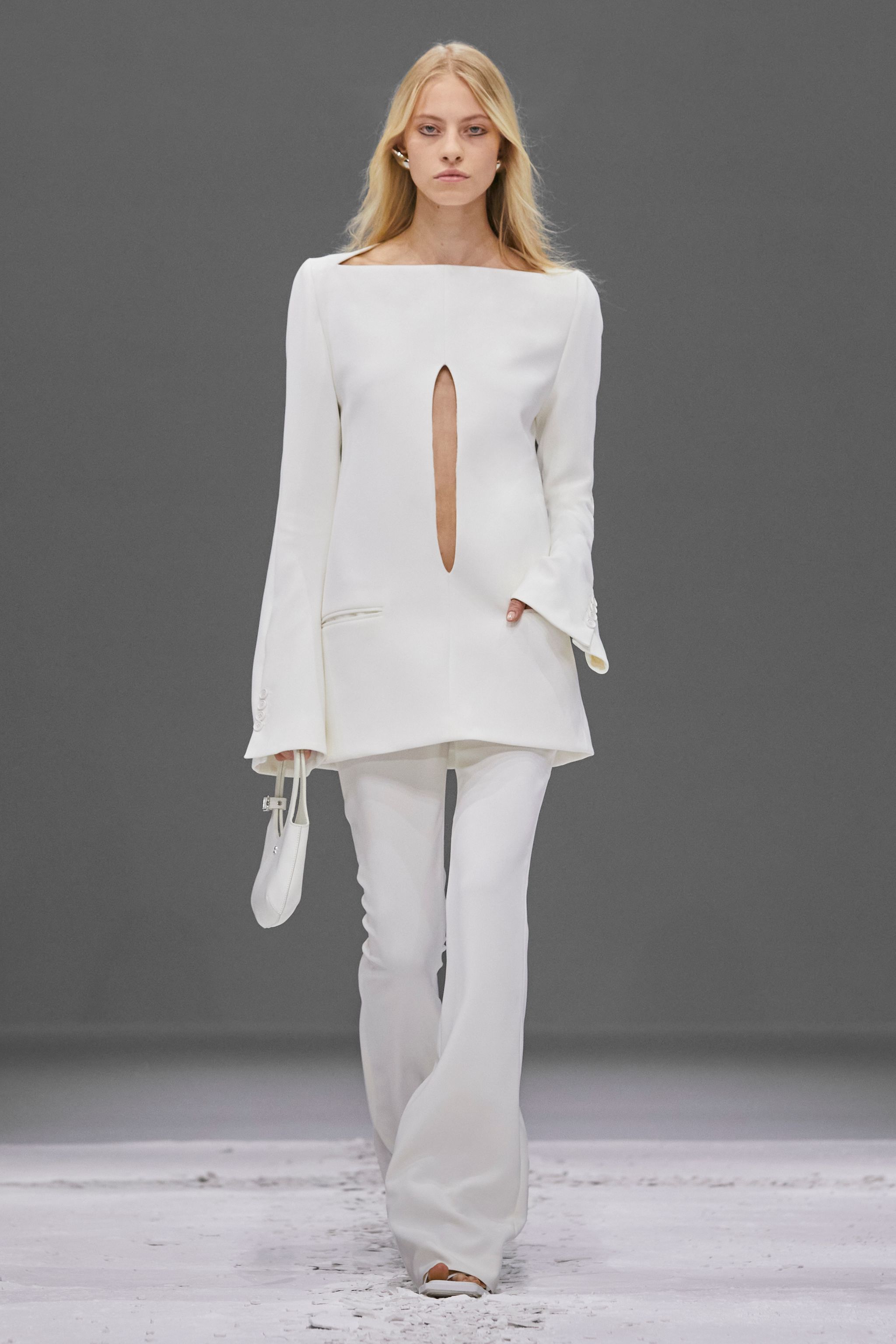 Elegant white Courrèges fashion ensemble featuring a stylish top with keyhole detail, perfect for ecommerce.