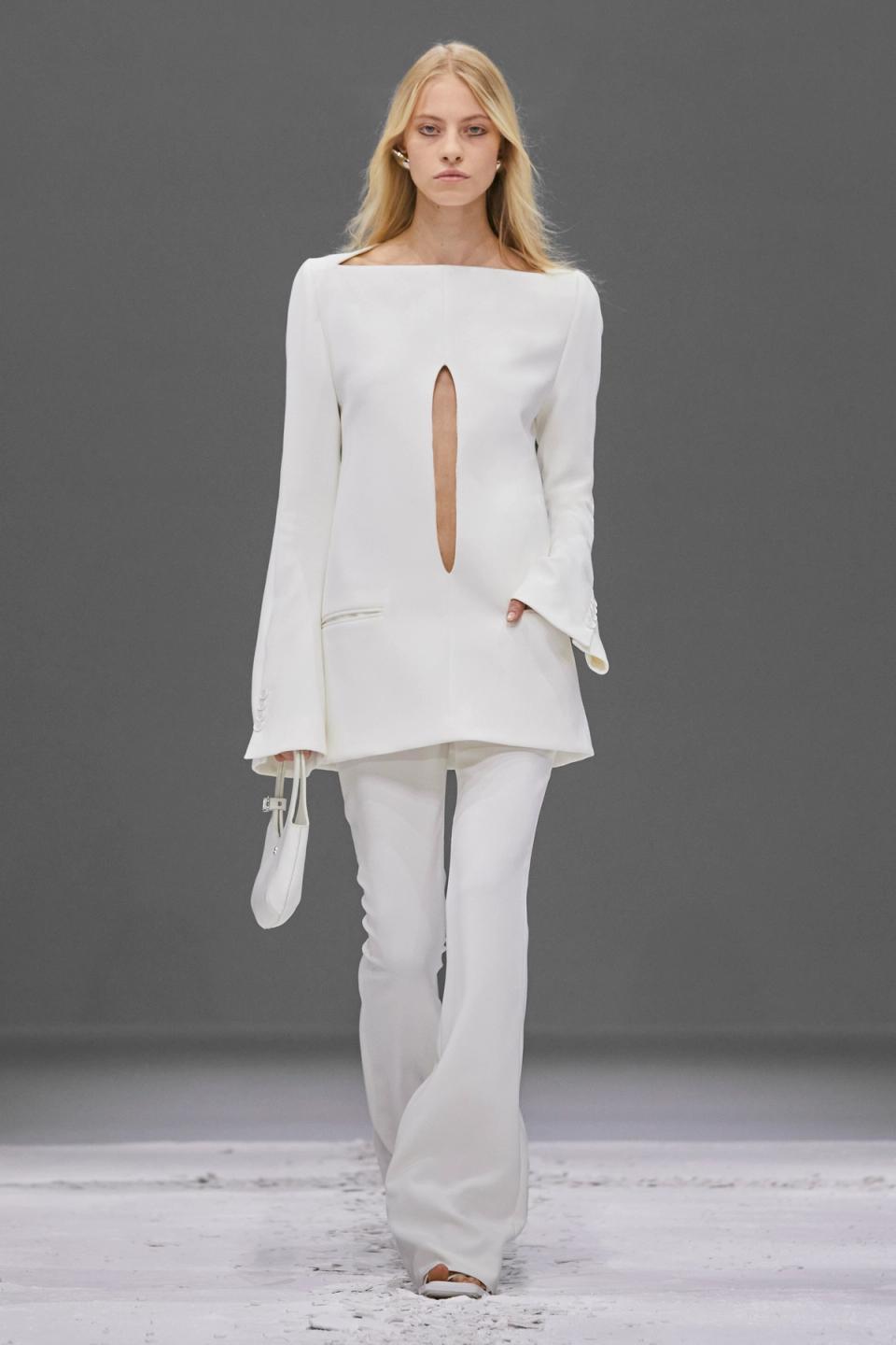 Elegant white Courrèges fashion ensemble featuring a stylish top with keyhole detail, perfect for ecommerce.