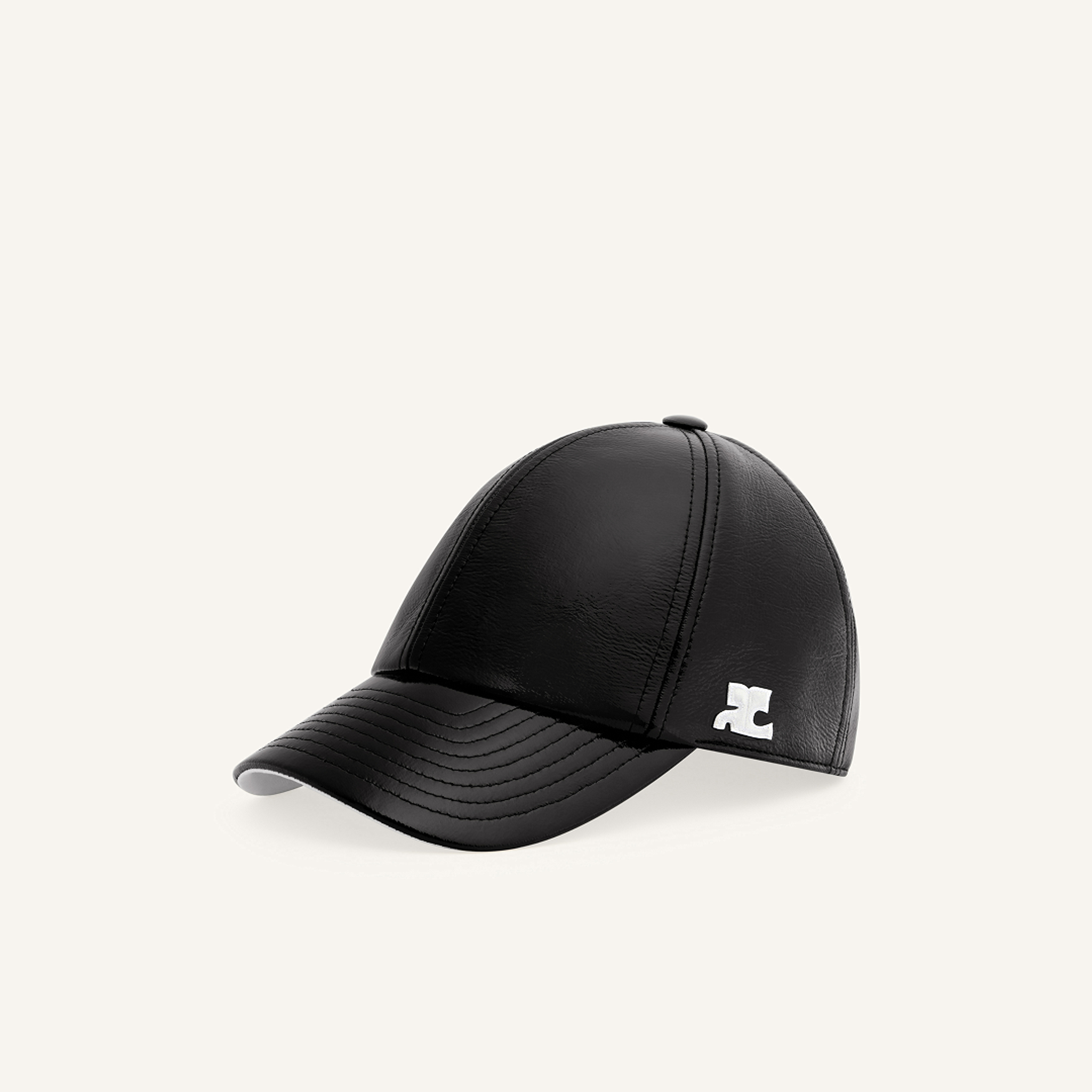 Elegant black leather baseball cap with Courrèges logo, perfect for modern fashion styles.