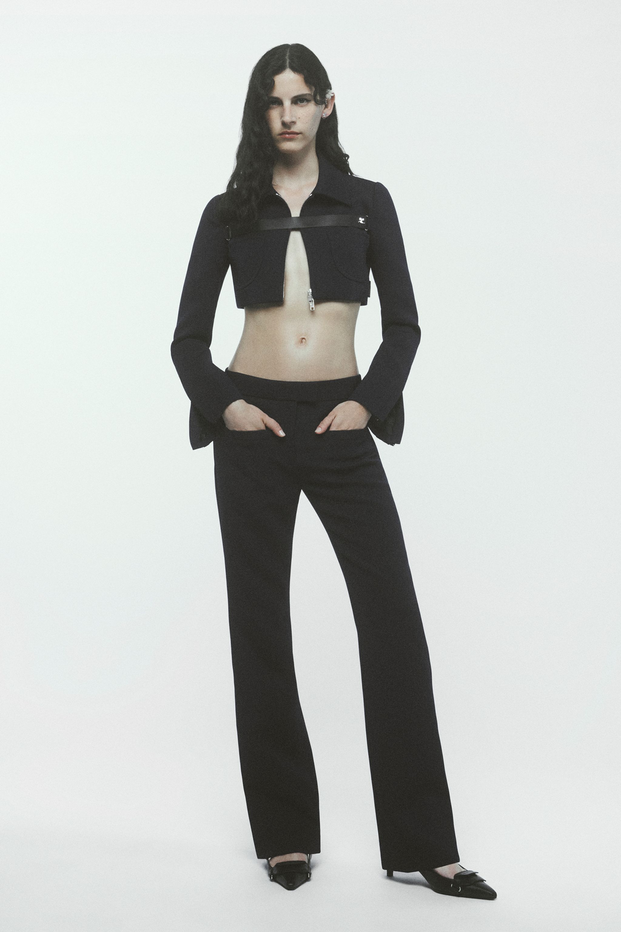 Elegant black cutout blazer and pants outfit showcasing Courrèges fashion for ecommerce.