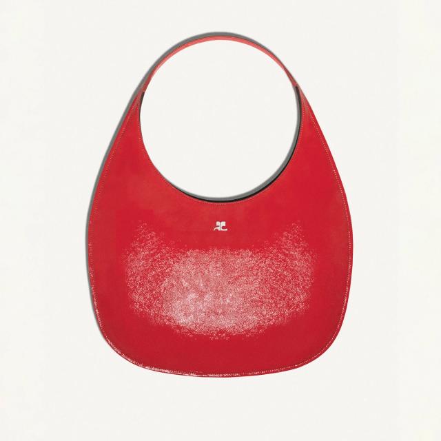 Elegant red Courrèges handbag with a minimalist design, suitable for fashion-forward accessories.