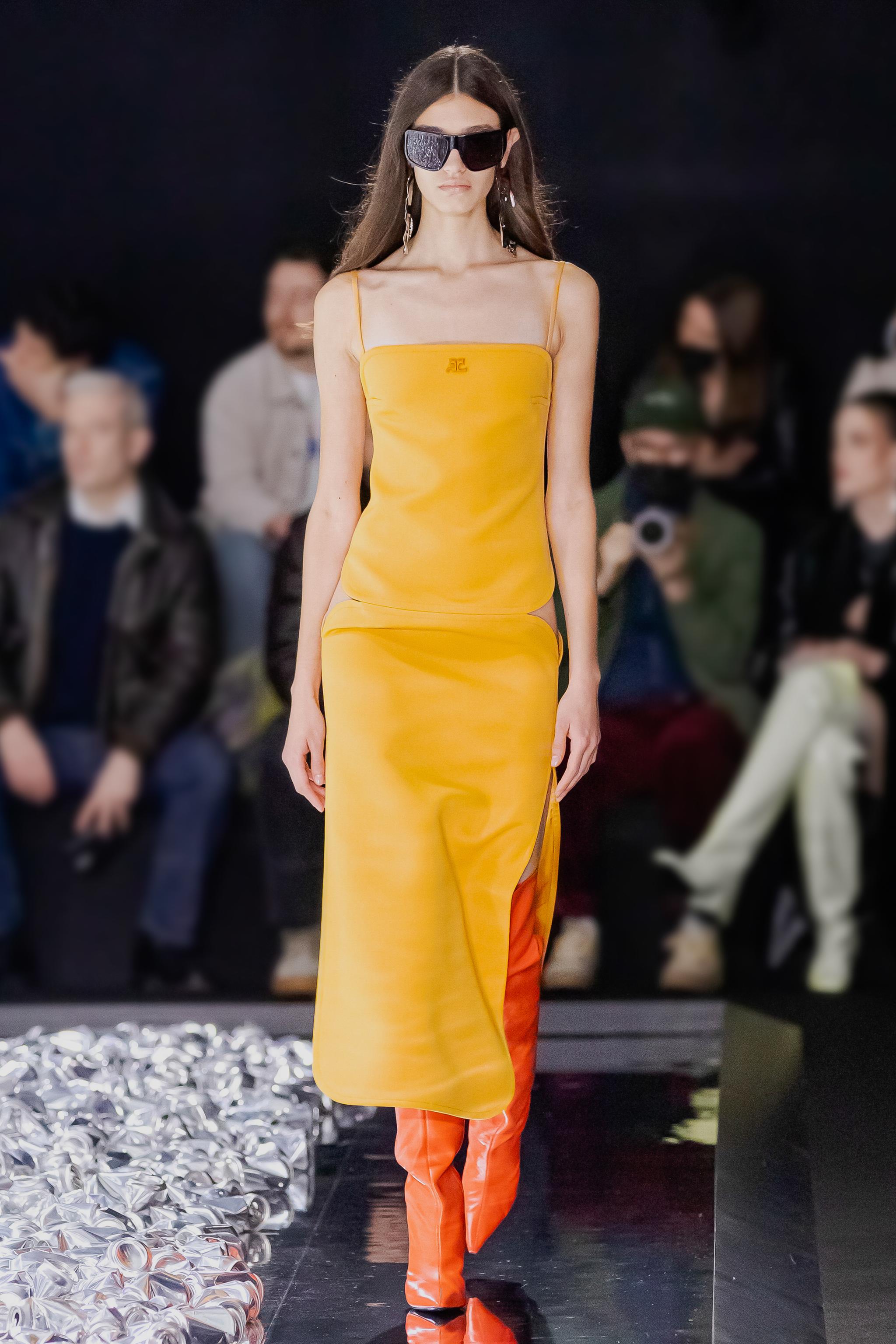 Elegant yellow Courrèges fashion dress with modern style, perfect for runway and photo shoots.