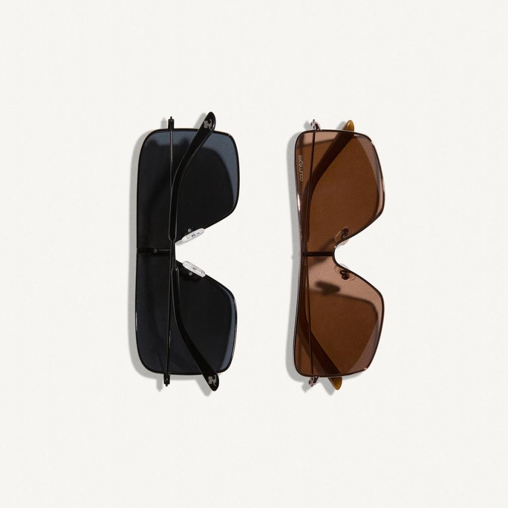 Elegant sunglasses by Courrèges featured in black and brown with modern styles for fashion.
