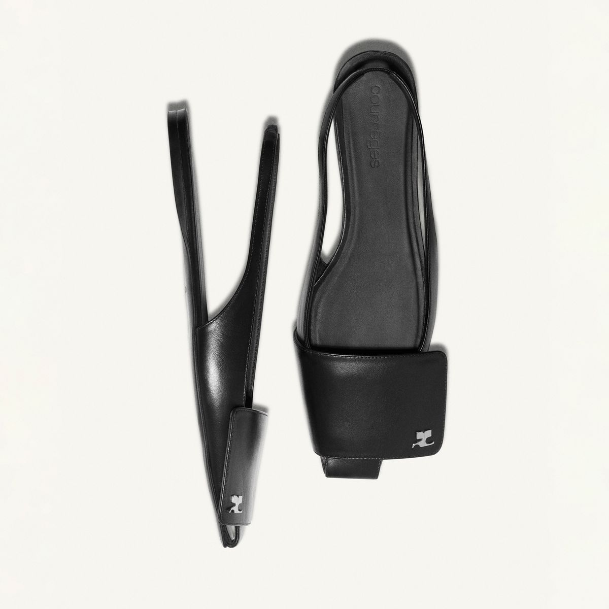 Elegant black leather sandals with a modern design, perfect for Courrèges fashion style.