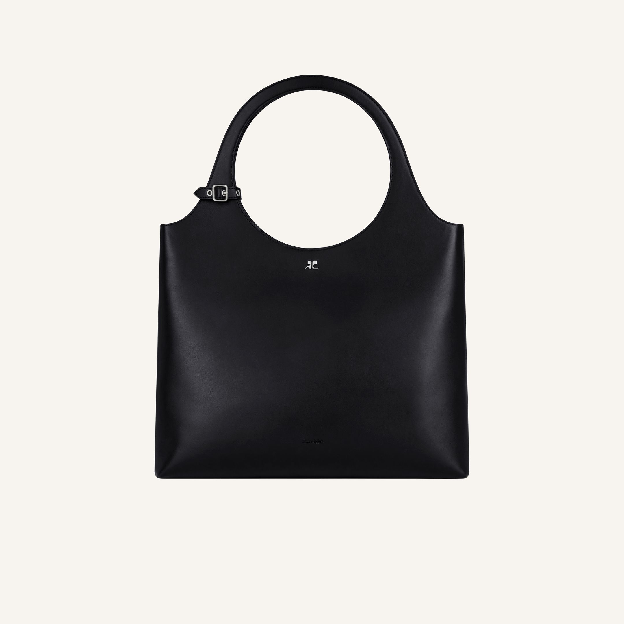 Sac cabas noir élégant de Courrèges avec poignée ronde, idéal pour un style moderne.