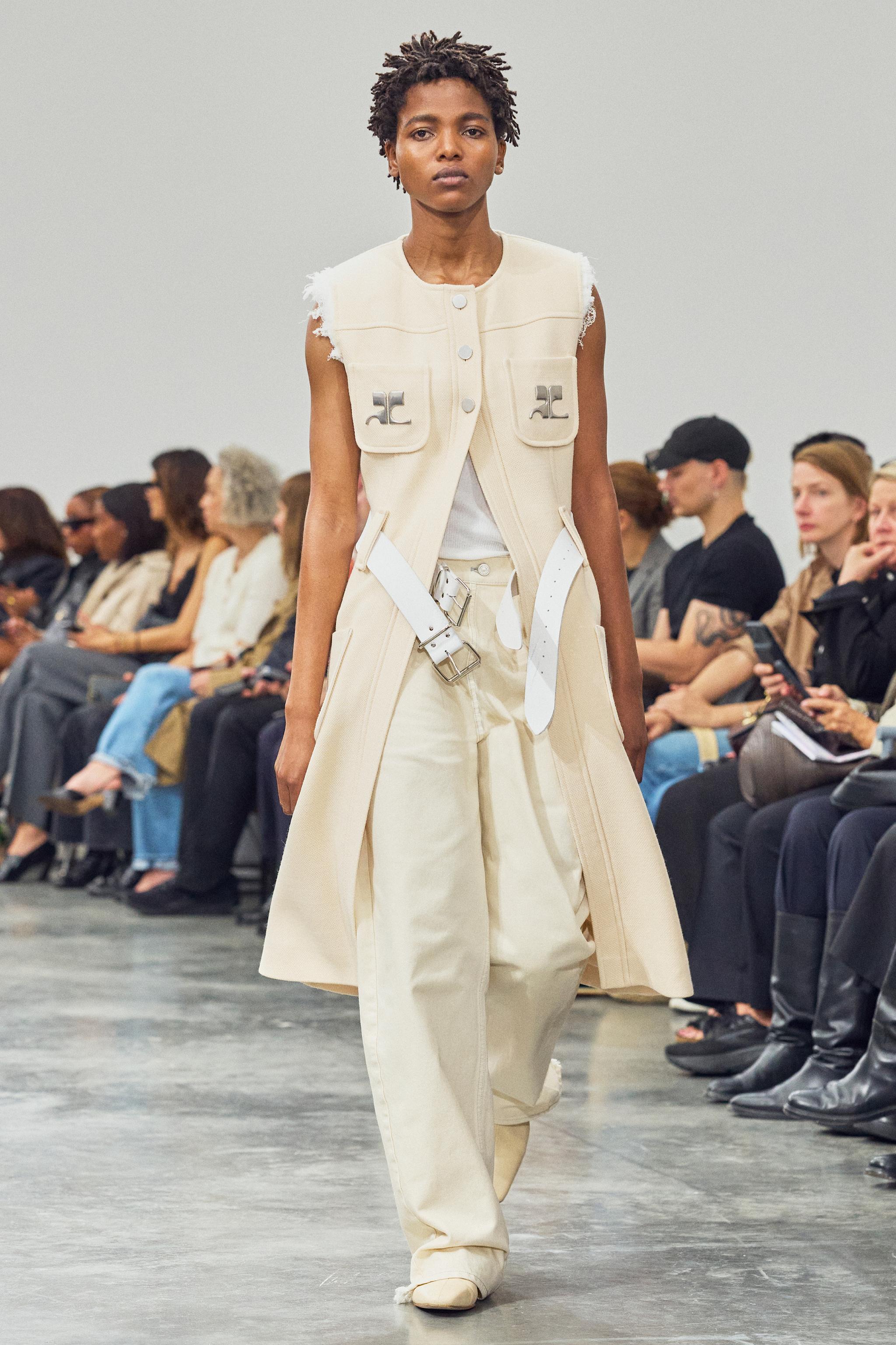 Elegant beige fashion model runway look, showcase for Courrèges brand on a stylish ecommerce site.