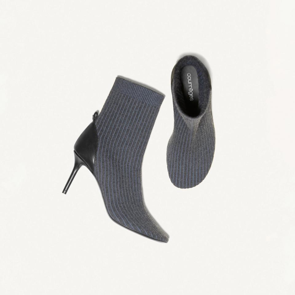Elegant Courrèges sock boots with high heels, featuring a sleek black and navy design for fashion.