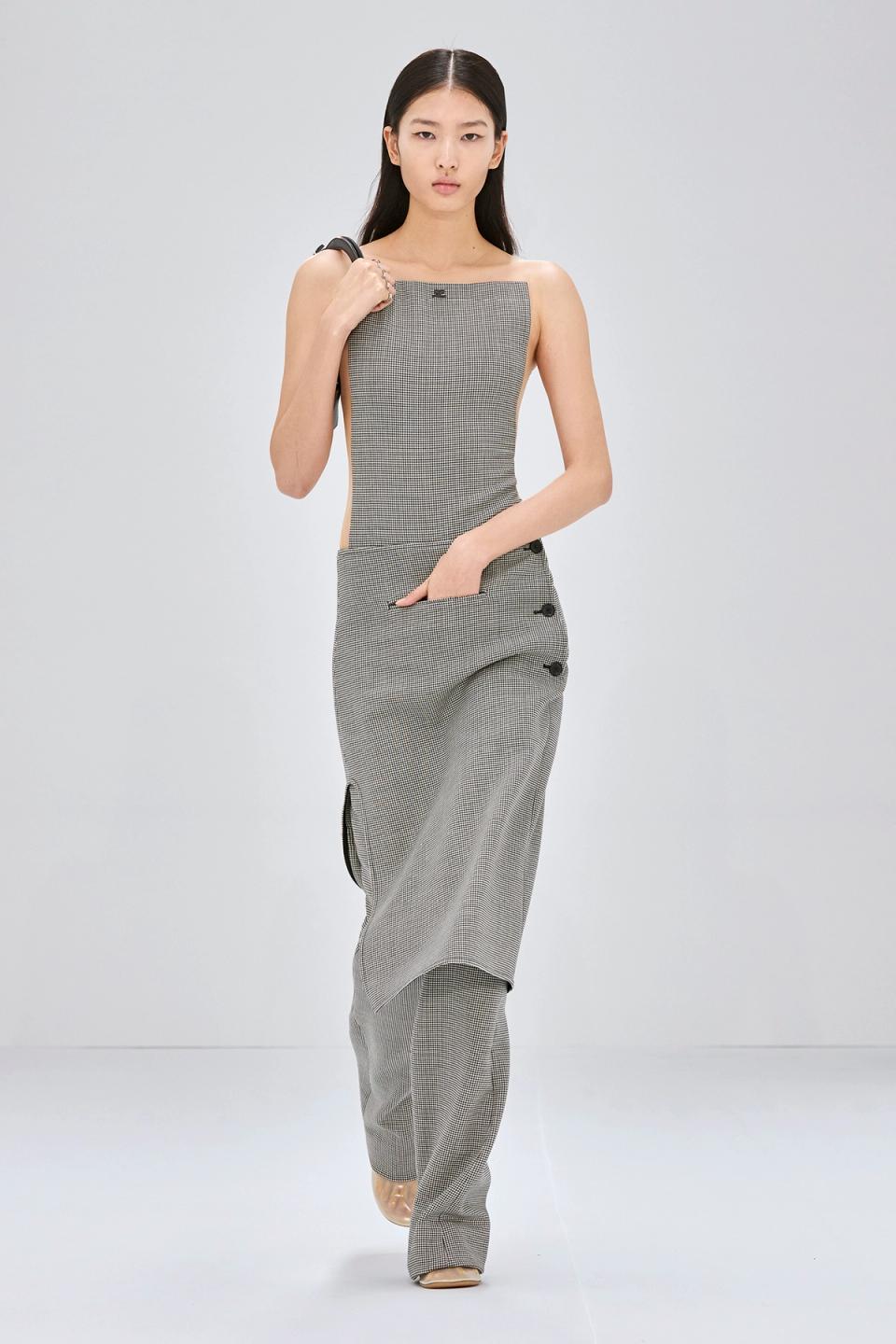 Elegant model wearing Courrèges checkered top and pants for a modern fashion statement.