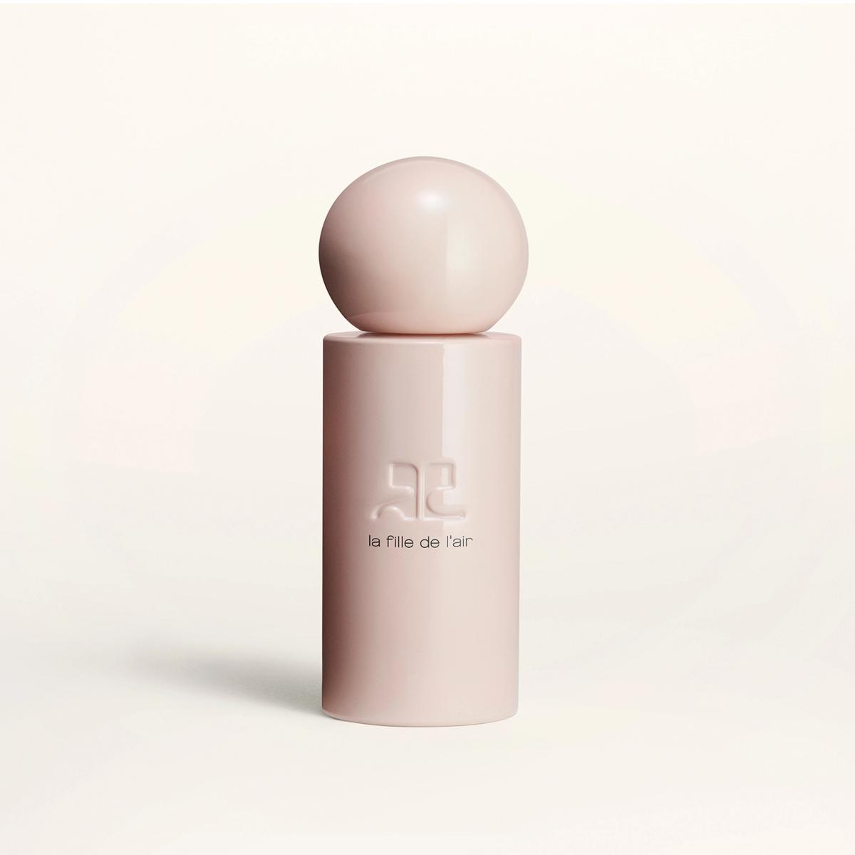 Elegant pink perfume bottle with rounded cap, showcasing Courrèges' sophisticated style.