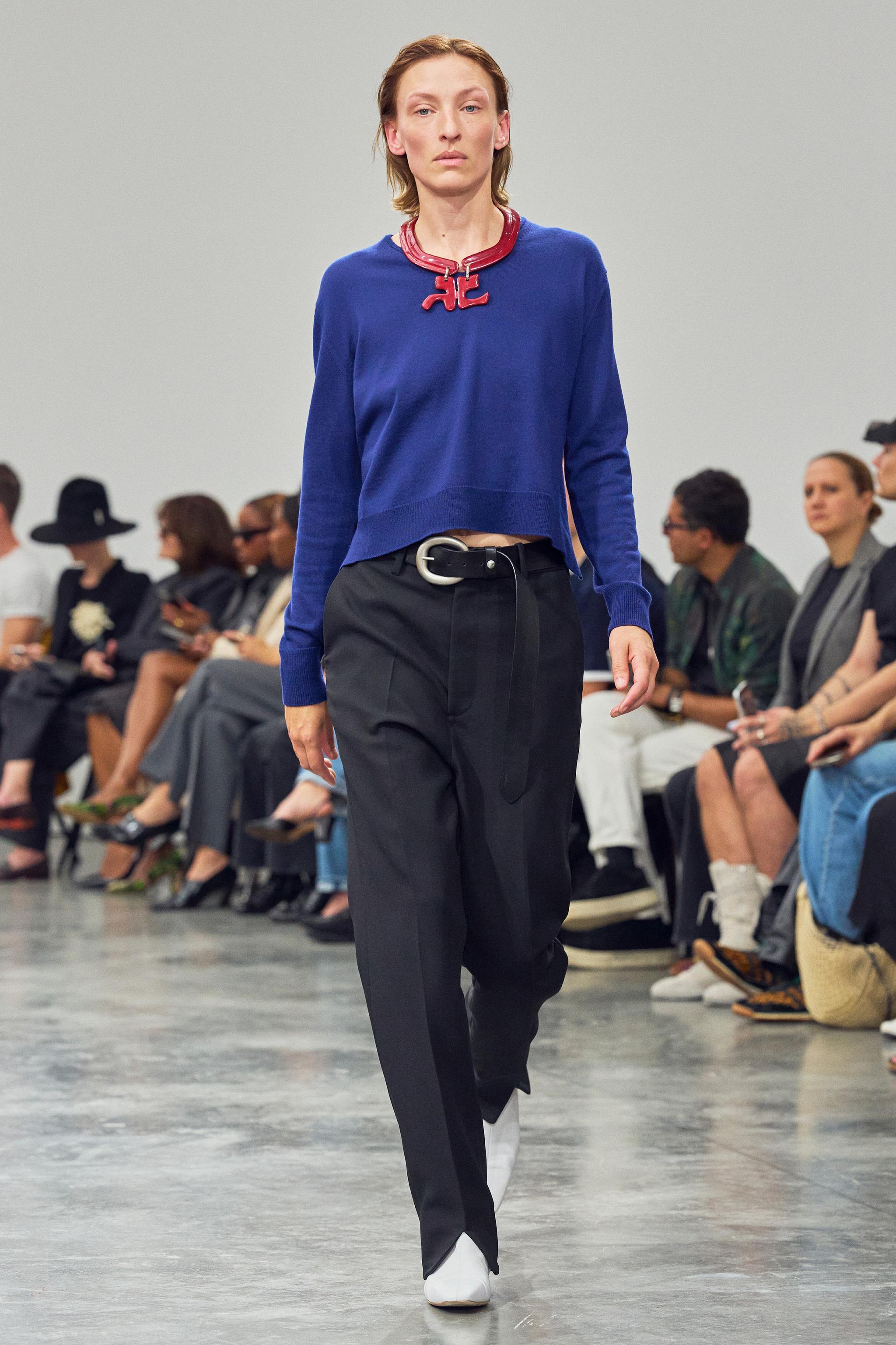 Elegant blue sweatshirt from Courrèges showcased here at a fashion runway.