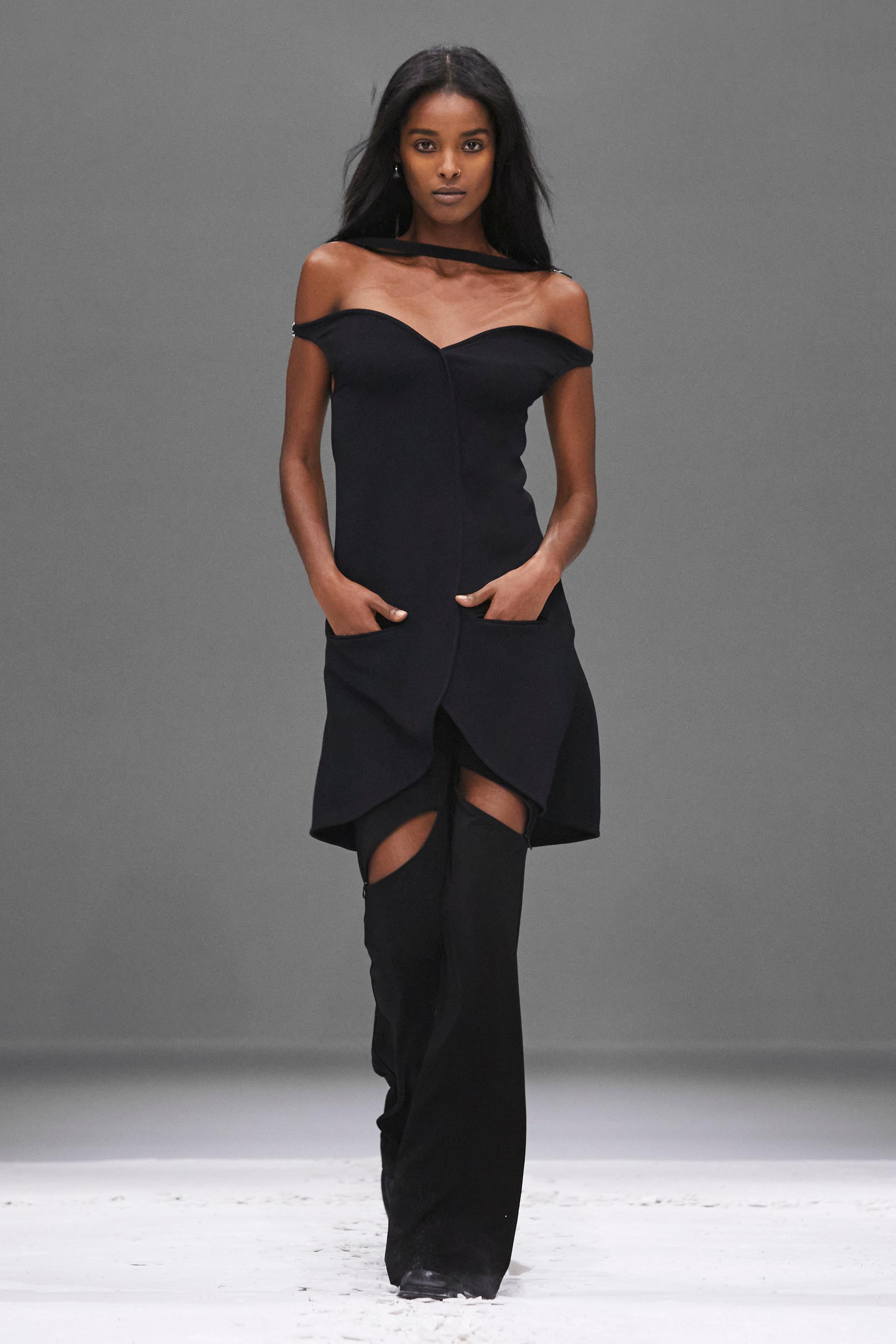Elegant black dress with sheer neckline from Courrèges, perfect for fashion-forward looks.