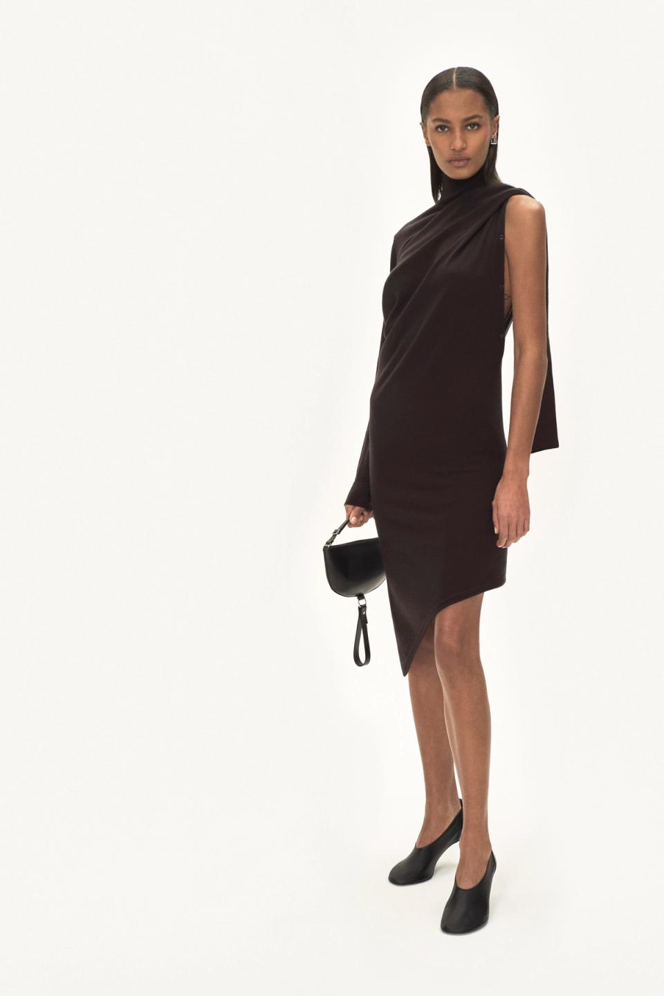 Elegant black midi dress with draped sleeve details, perfect for Courrèges fashion looks.