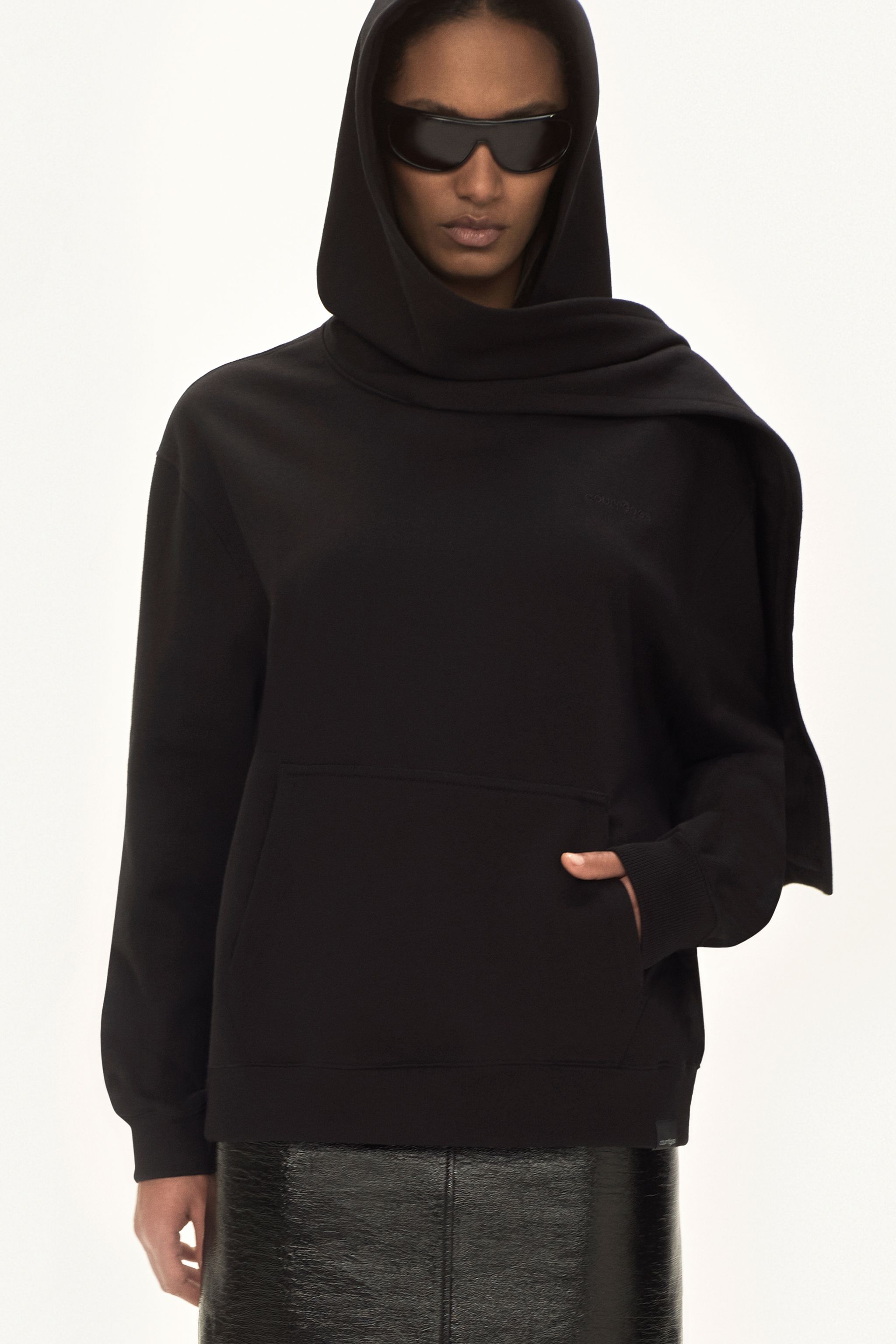 Elegant black hoodie with oversized fit and logo detail, perfect for Courrèges fashion lovers.
