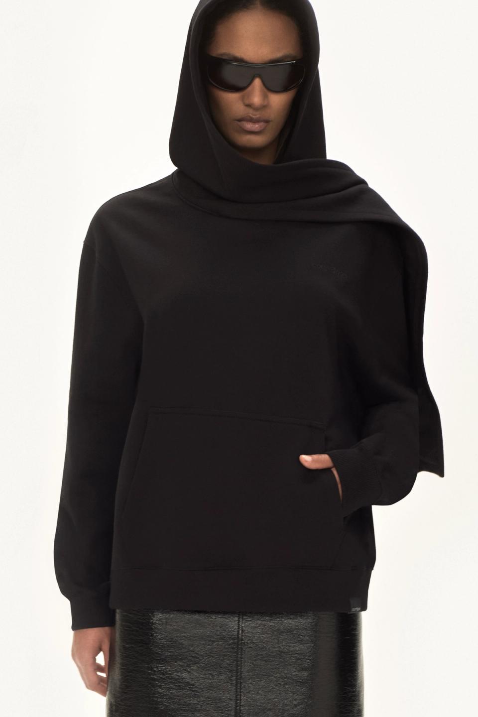 Elegant black hoodie with oversized fit and logo detail, perfect for Courrèges fashion lovers.