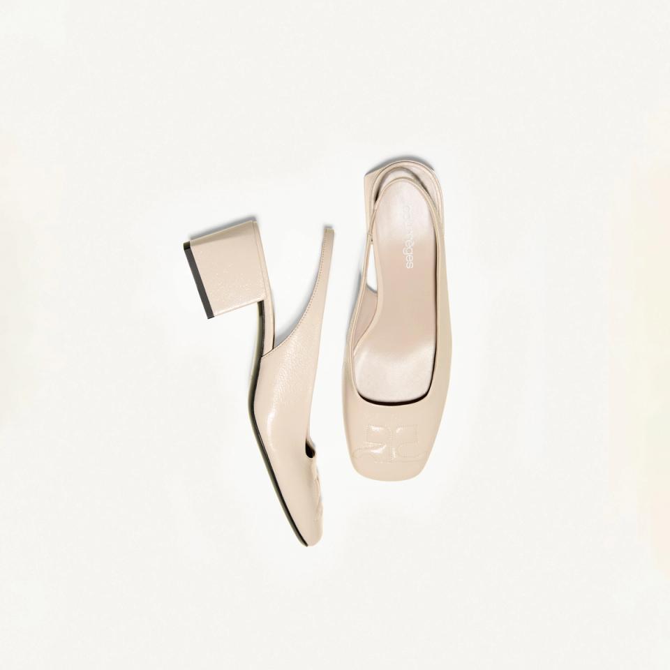Elegant beige Courrèges high-heeled shoes with a modern design for fashion lovers.