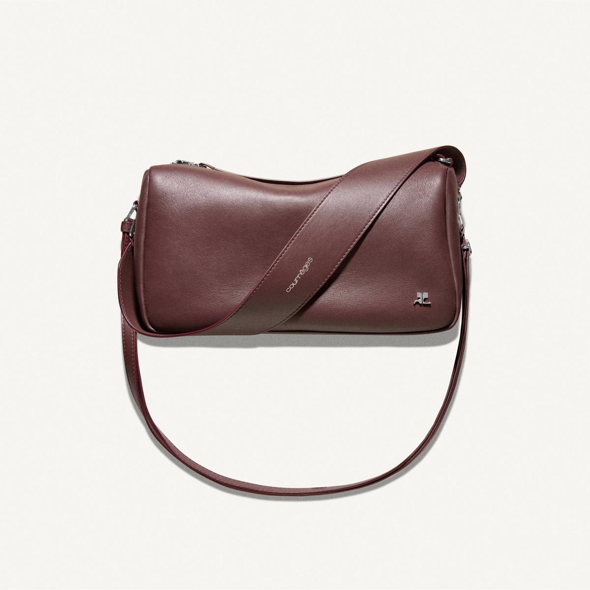 Elegant maroon leather shoulder bag by Courrèges for modern fashion accessibility.