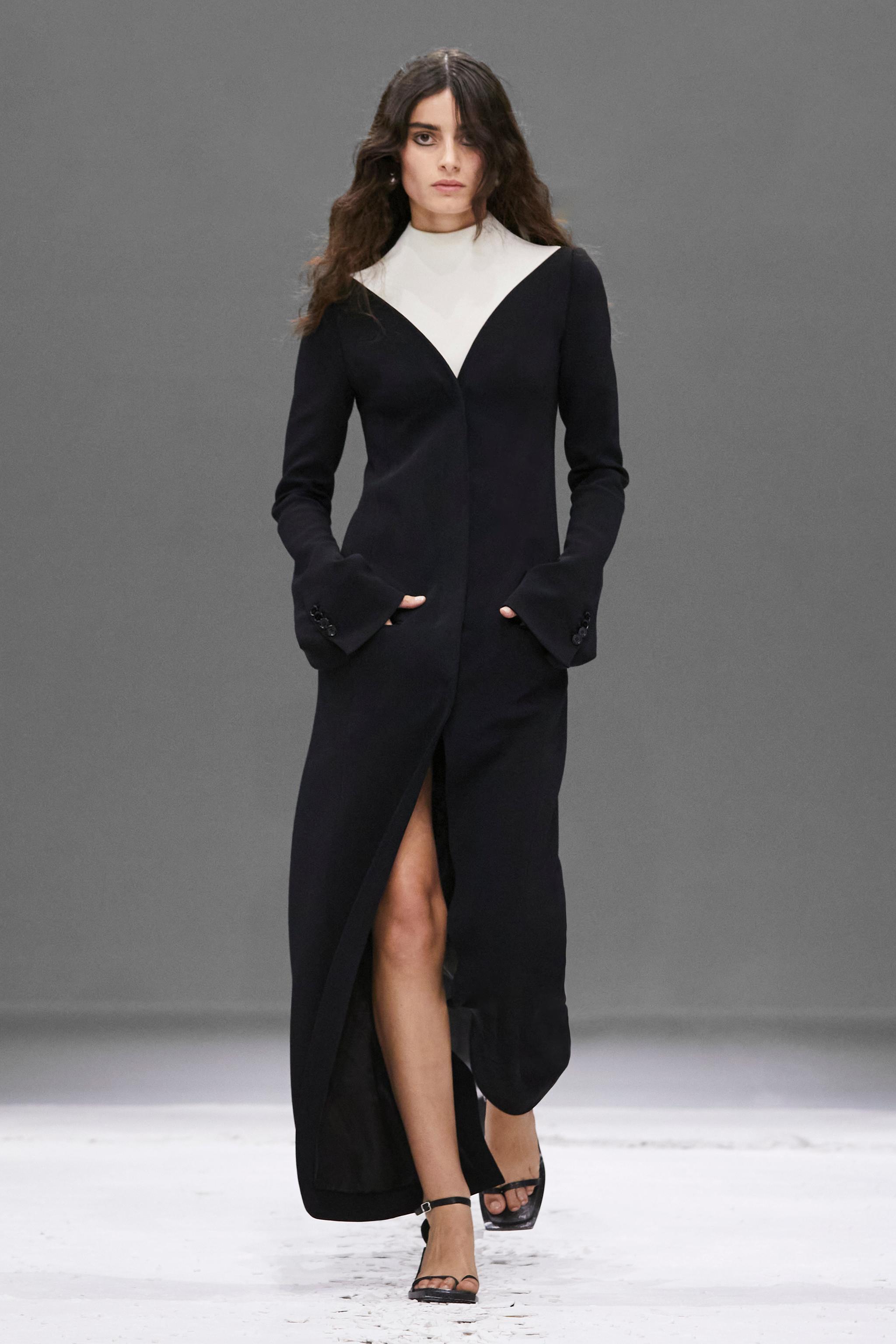 Elegant black dress by Courrèges with white accents, runway fashion for an exclusive wardrobe.