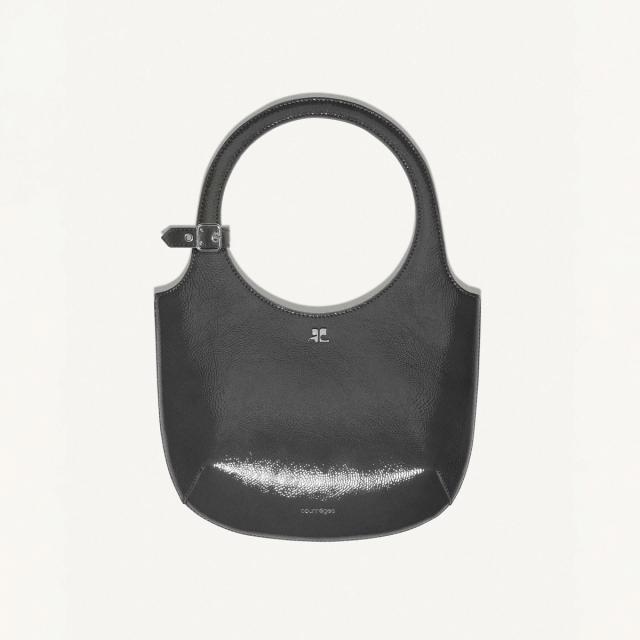 Elegant black leather handbag with a circular handle, featuring Courrèges branding for fashion.