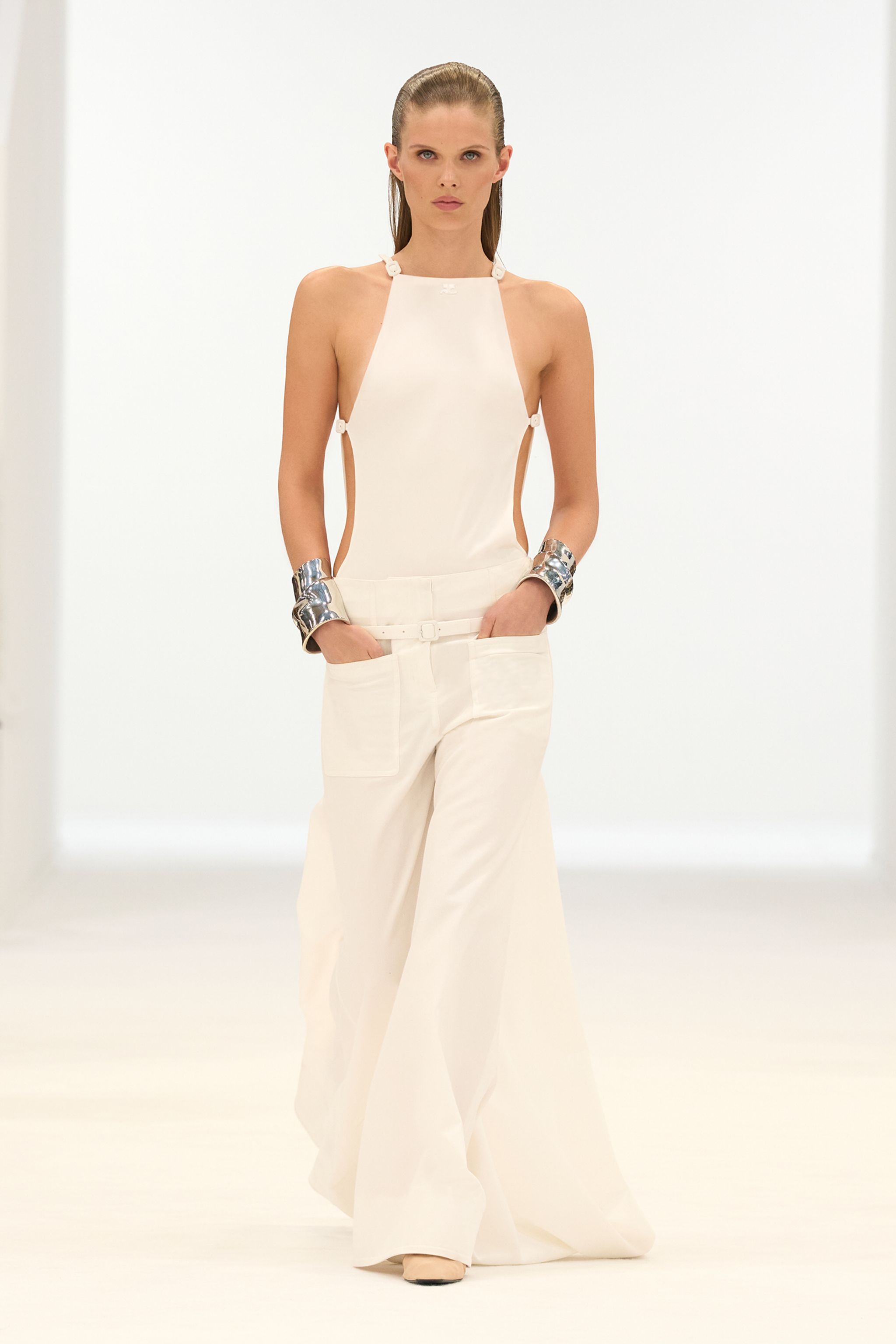 Elegant white fashion ensemble showcasing Courrèges style, perfect for modern chic looks.