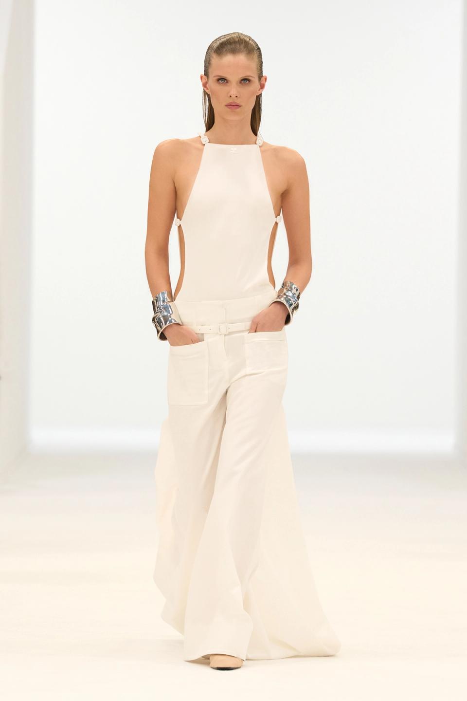 Elegant white fashion ensemble showcasing Courrèges style, perfect for modern chic looks.