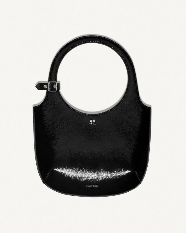 Elegant red handbag with a circular handle, by Courrèges, showcased on an ecommerce site.