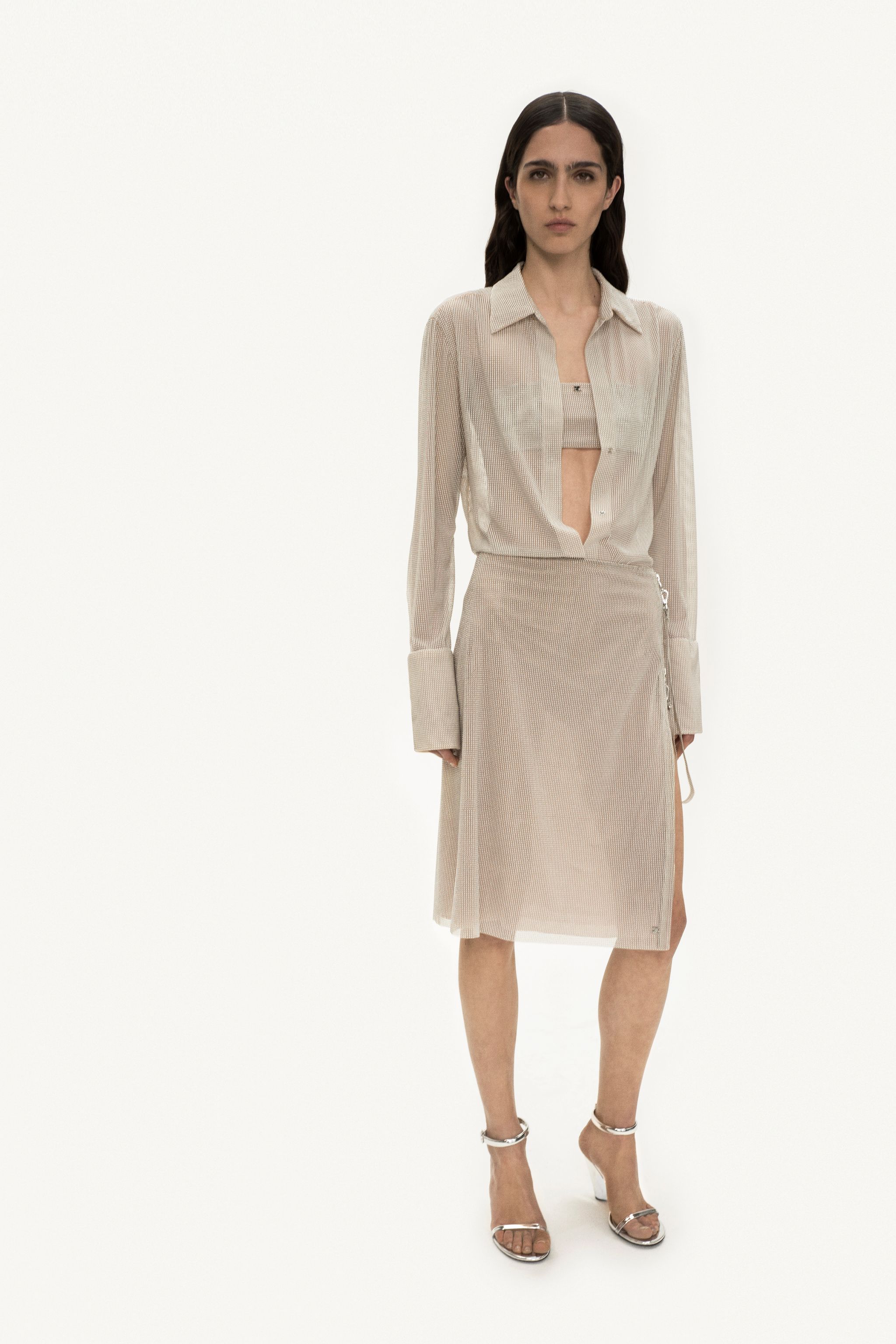 Elegant cream satin dress with asymmetric design by Courrèges, perfect for upscale fashion.