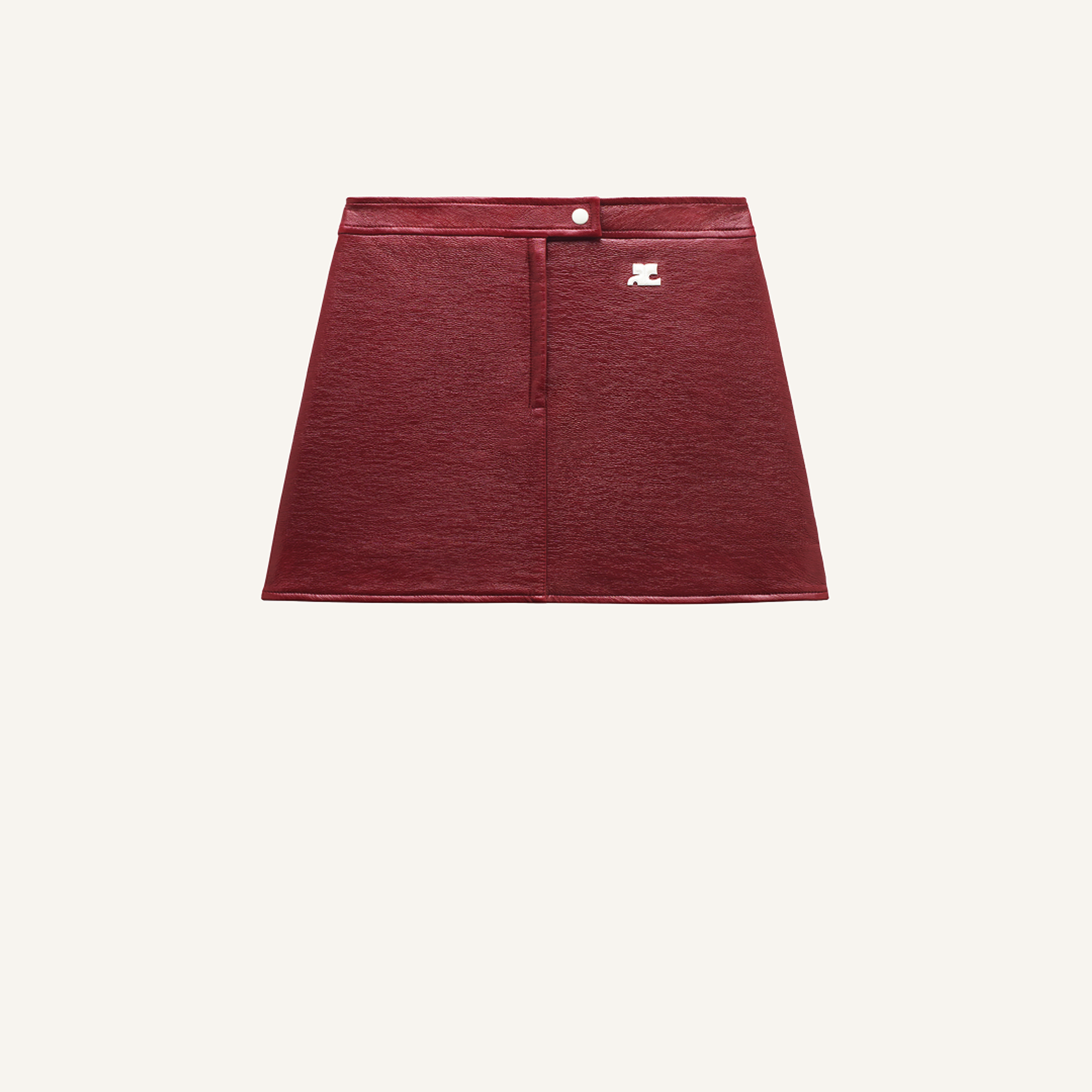 Elegant red leather mini skirt from Courrèges, perfect for stylish modern fashion looks.