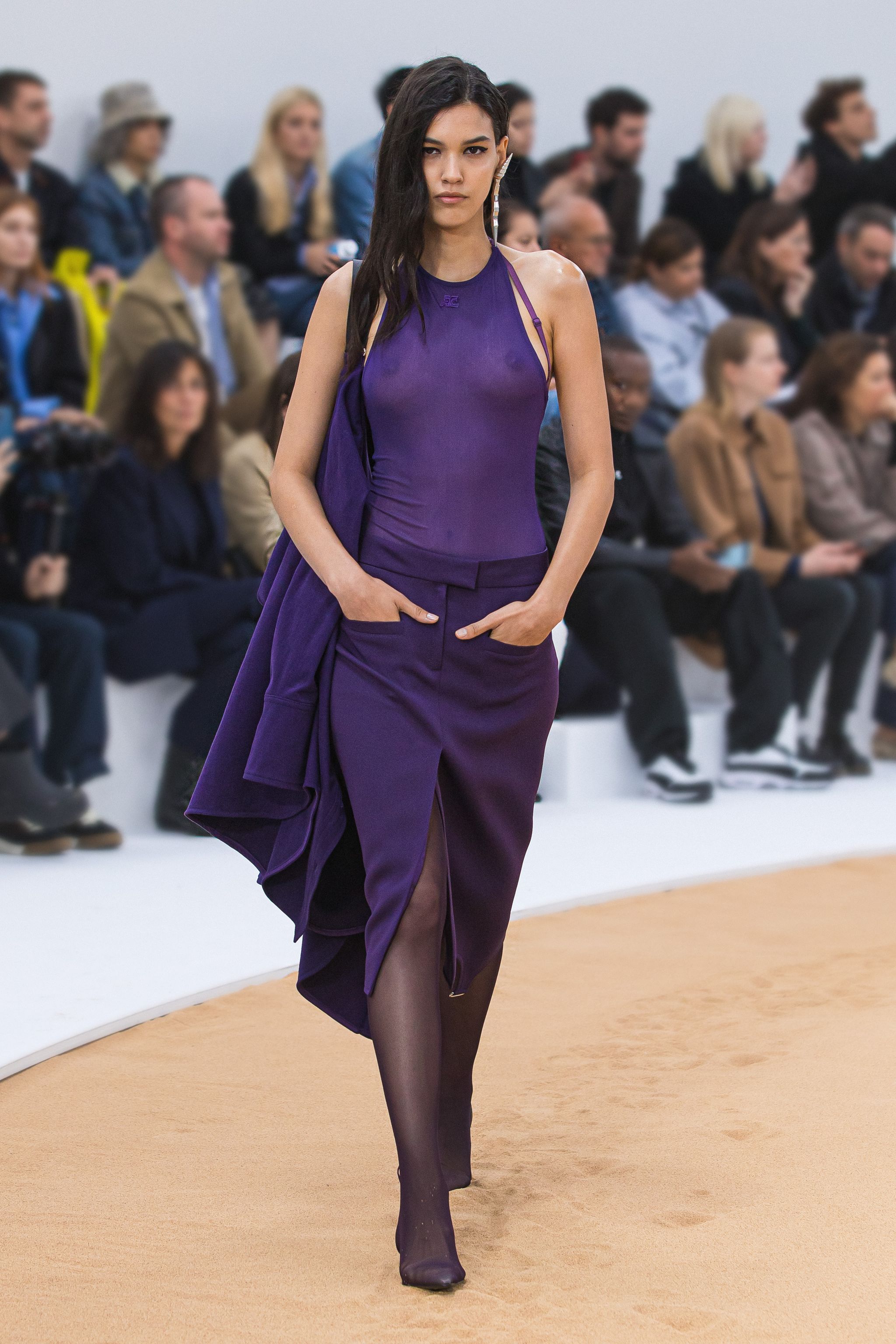 Elegant purple sleeveless dress on a fashion runway, showcased by Courrèges.