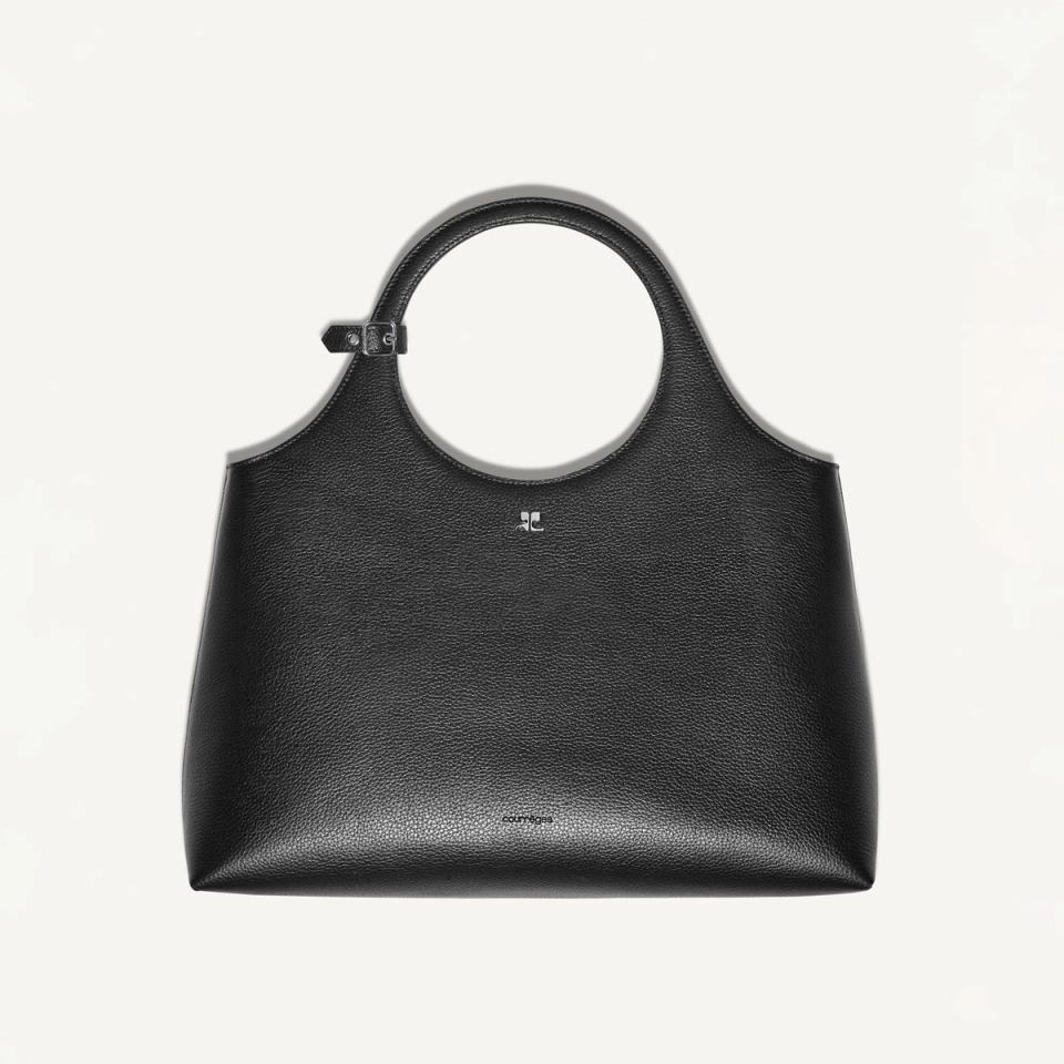 Elegant black Courrèges handbag with round handle, stylish accessory on an ecommerce site.