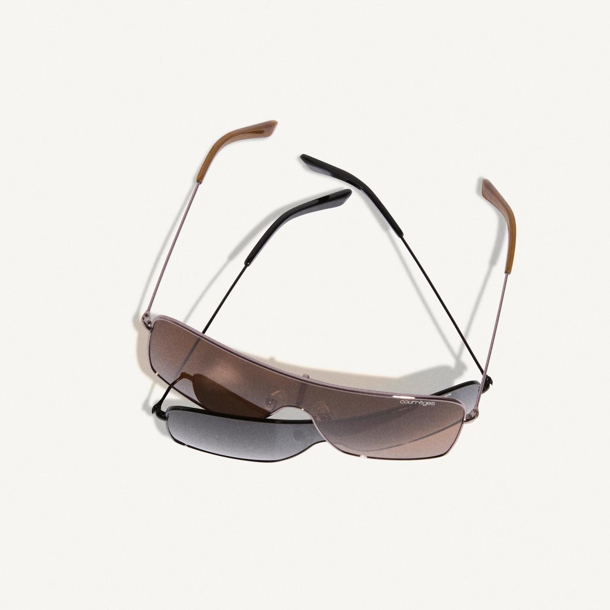 Elegant sunglasses with gradient lenses, designed by Courrèges, showcased for fashion enthusiasts.