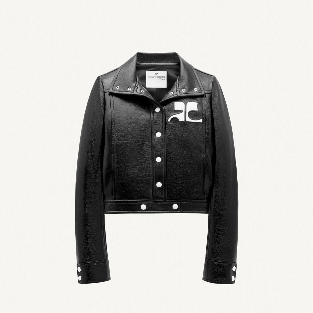Elegant black leather jacket with Courrèges logo, perfect for a high-end fashion look.