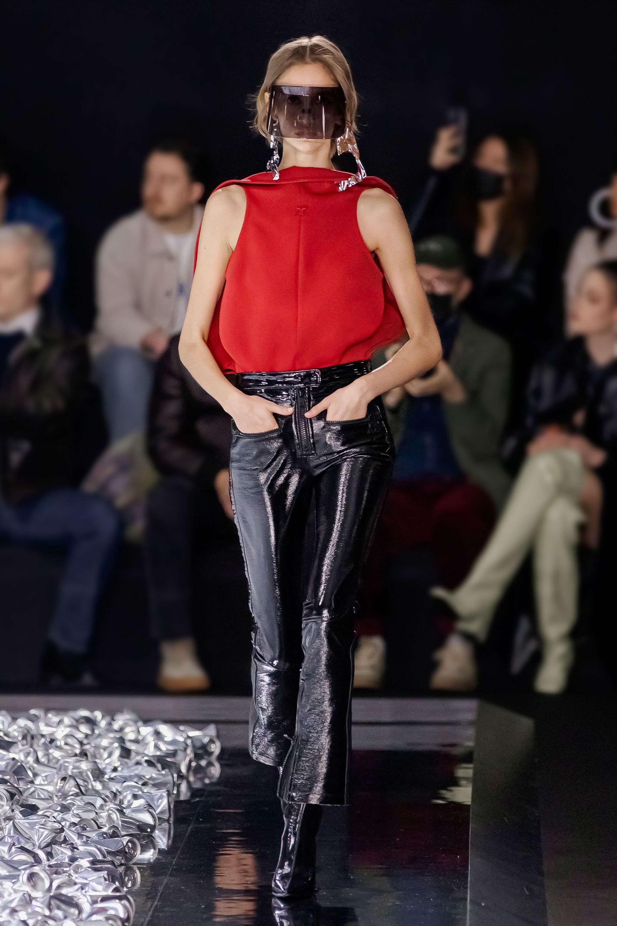 Elegant runway model showcasing Courrèges fashion in a modern, stylish outfit.