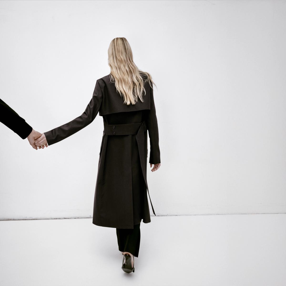 Elegant black trench coat from Courrèges, showcased for fashion lovers on an e-commerce site.