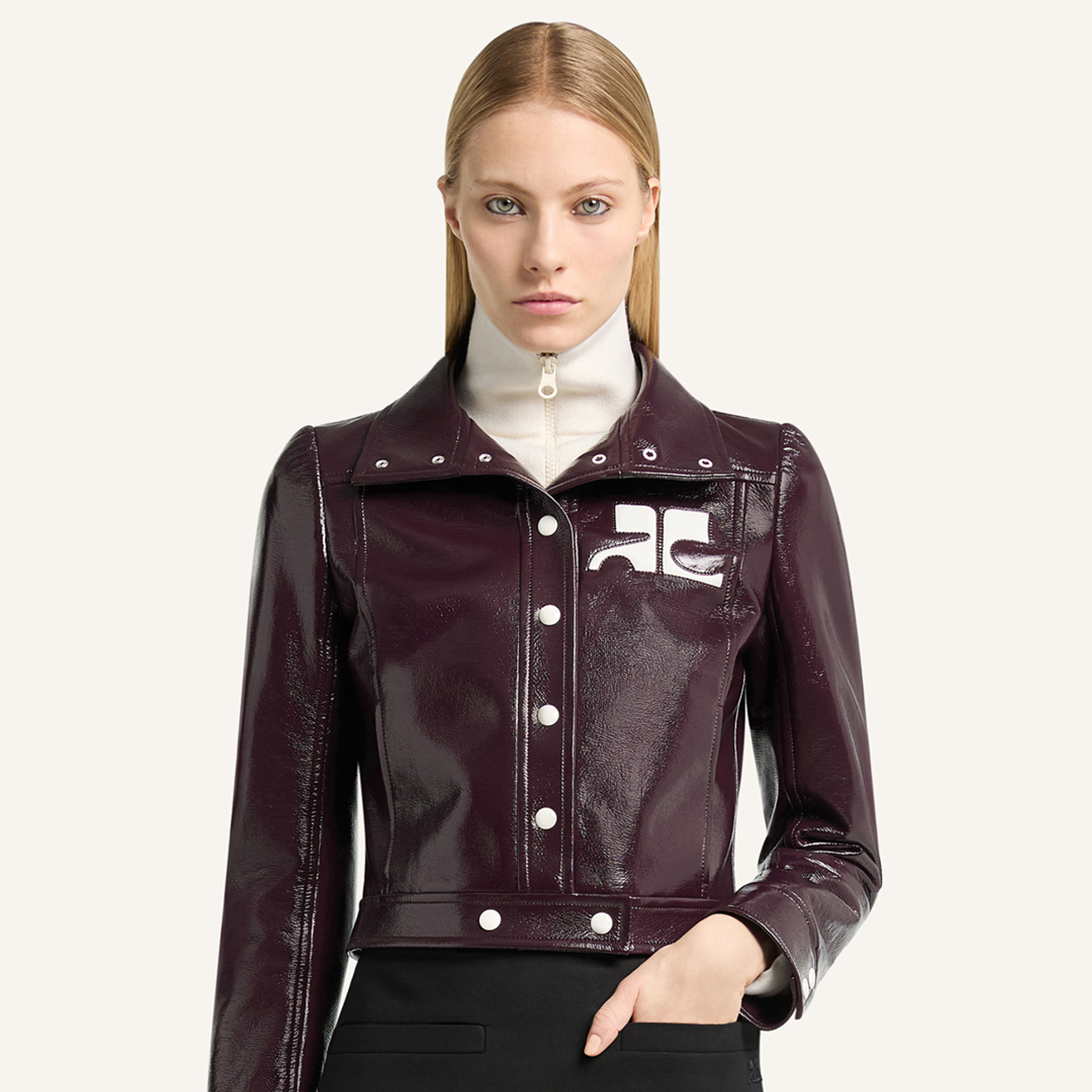 Elegant women's burgundy leather Courrèges jacket with white logo details, perfect for fashion.