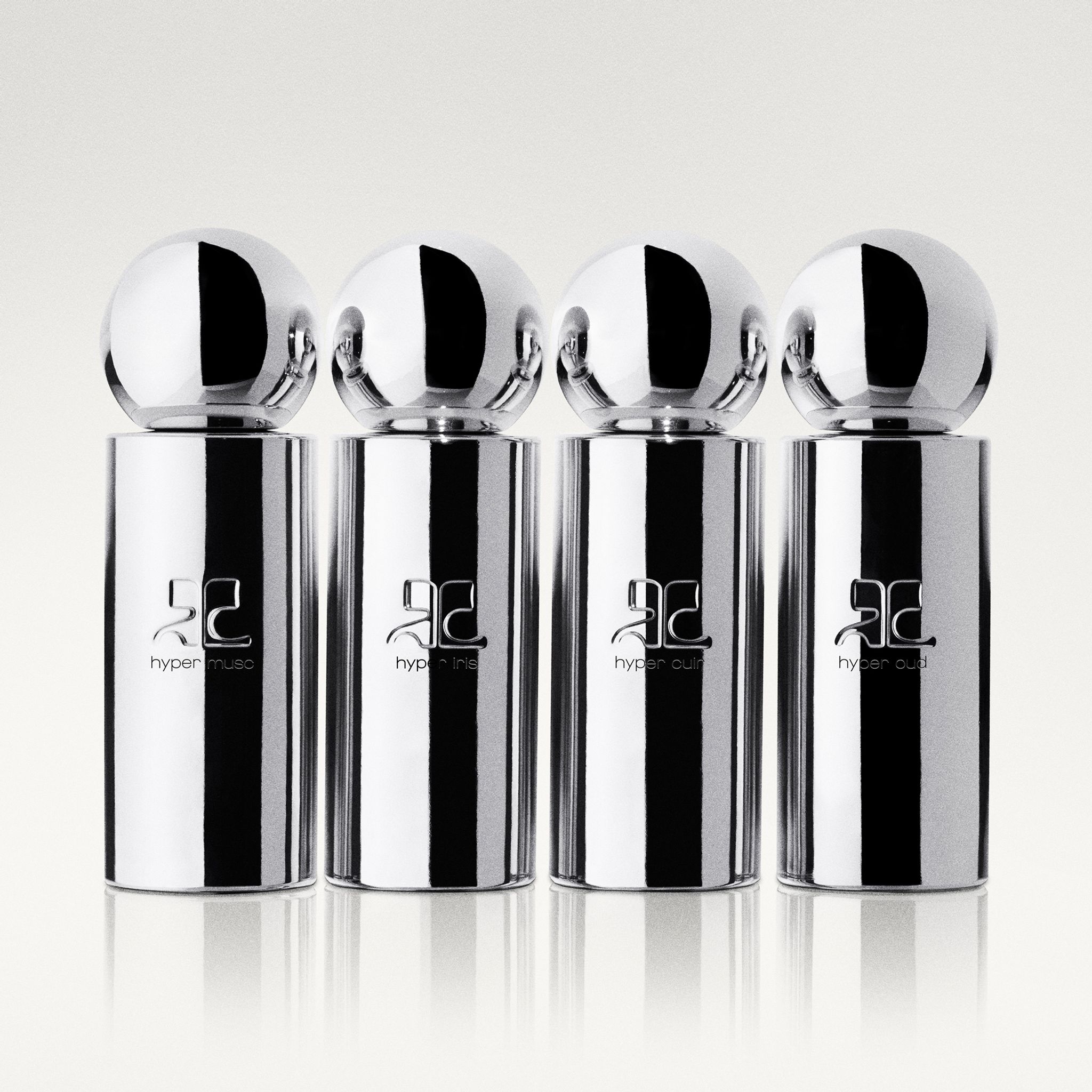 Elegant silver perfume bottles from Courrèges with a modern, high-fashion design.