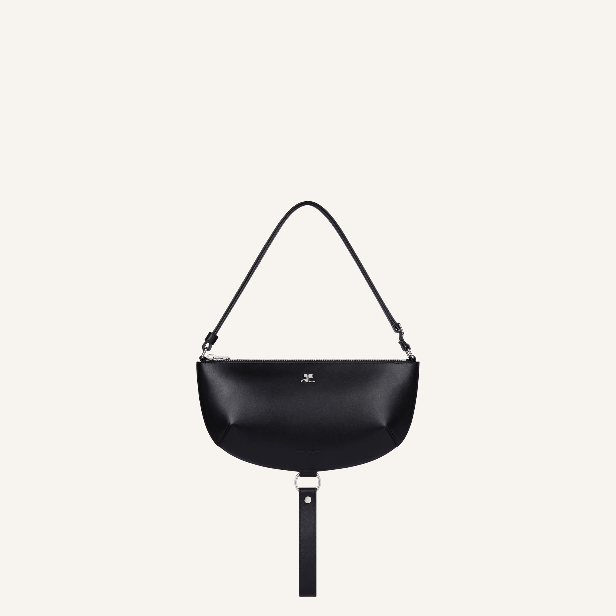 Elegant black leather handbag with minimalist design, featuring Courrèges branding for chic style.