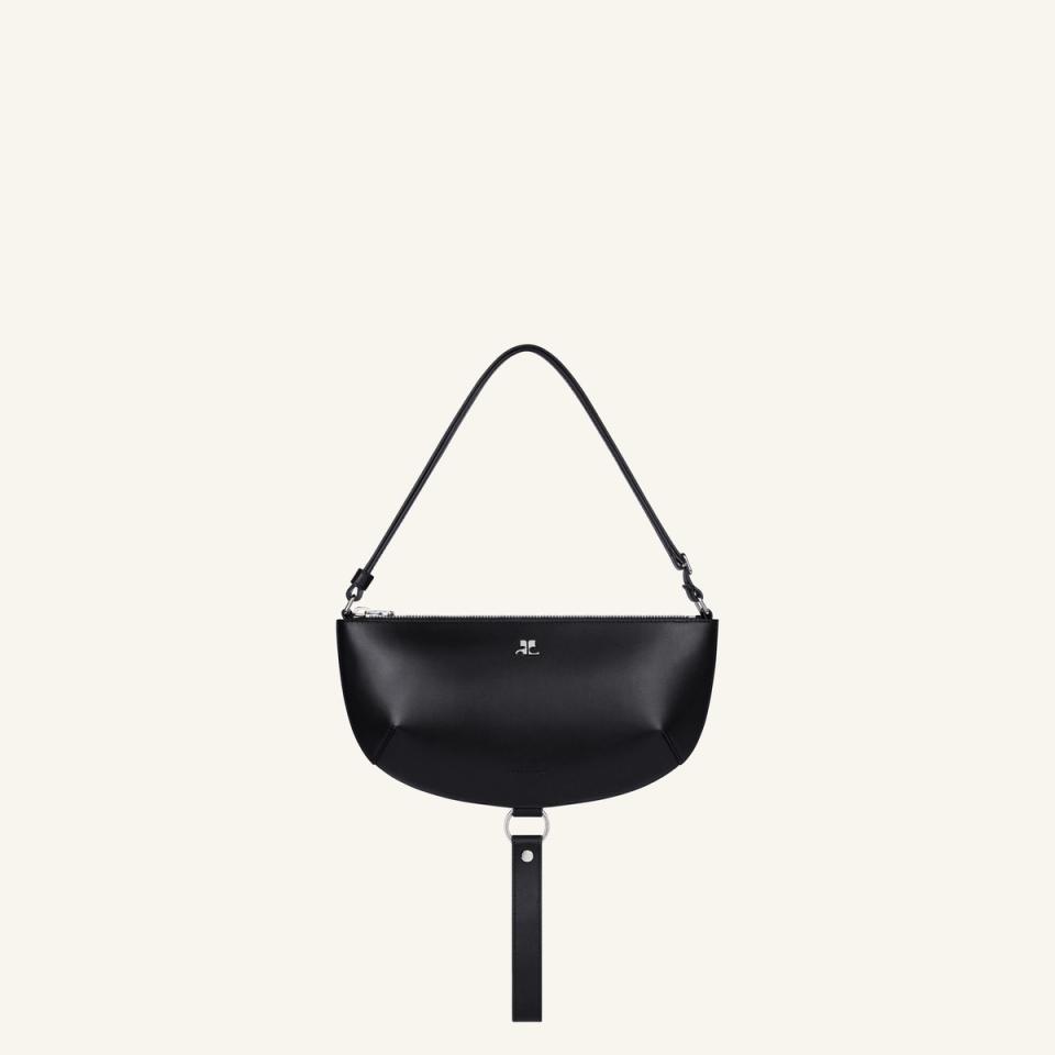Sac à main noir Courrèges élégant au design moderne, idéal pour des accessoires tendance.