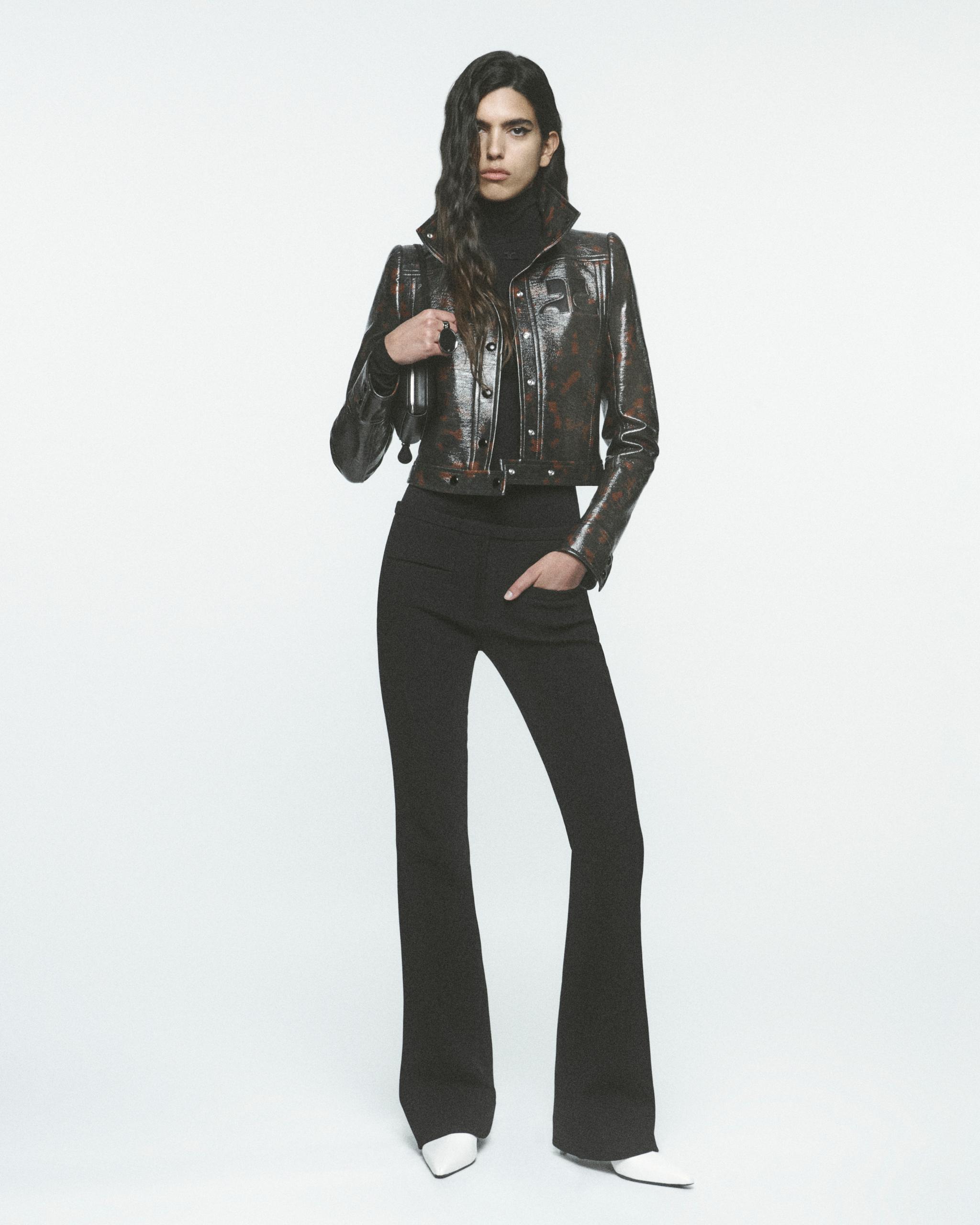 Elegant black leather jacket and stylish black pants for a chic Courrèges fashion look.